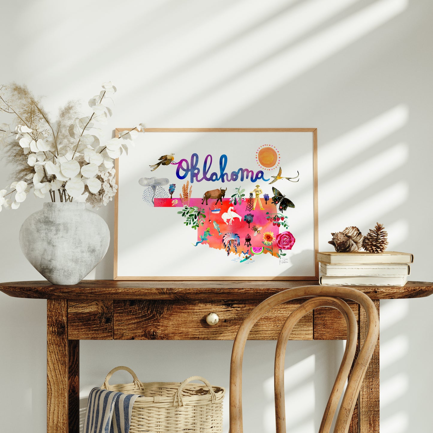 a wooden table with a vase of flowers on top of it