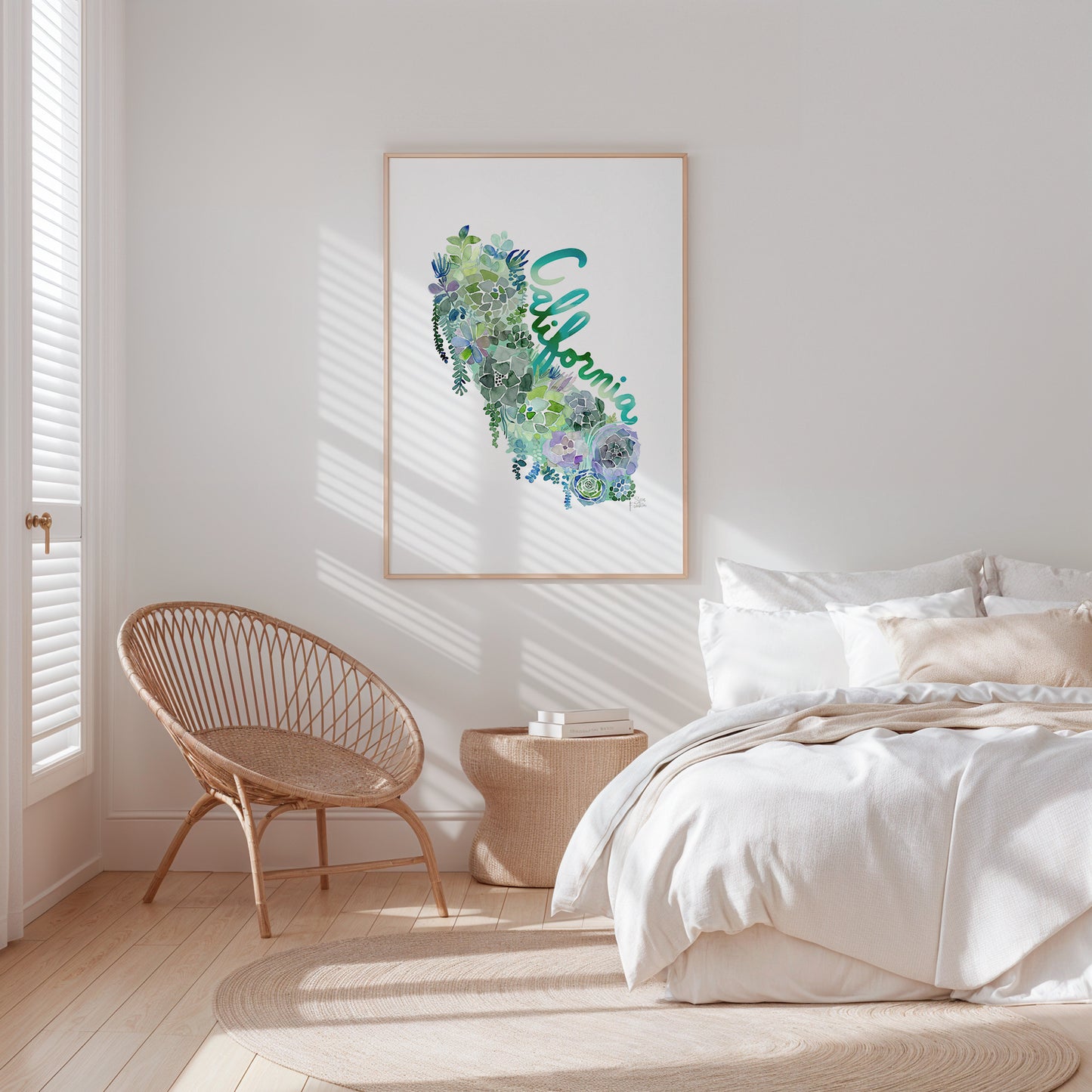a bedroom with a bed, chair, and picture on the wall