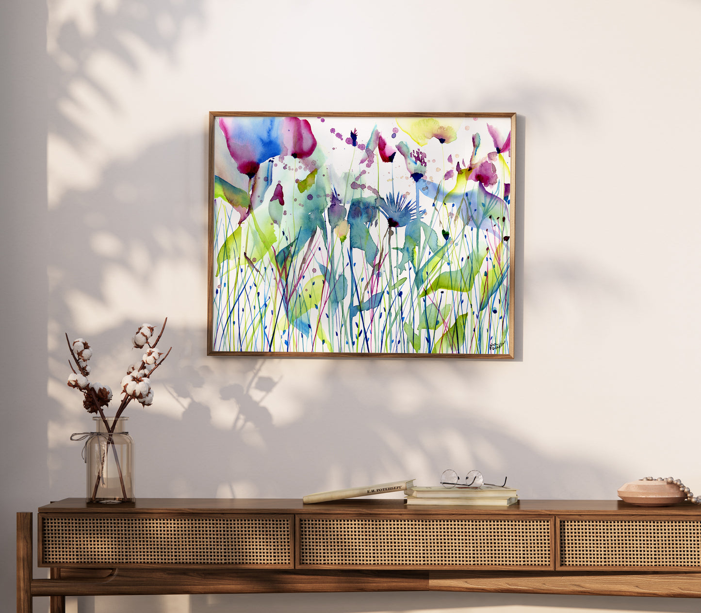 a painting hanging on a wall above a table