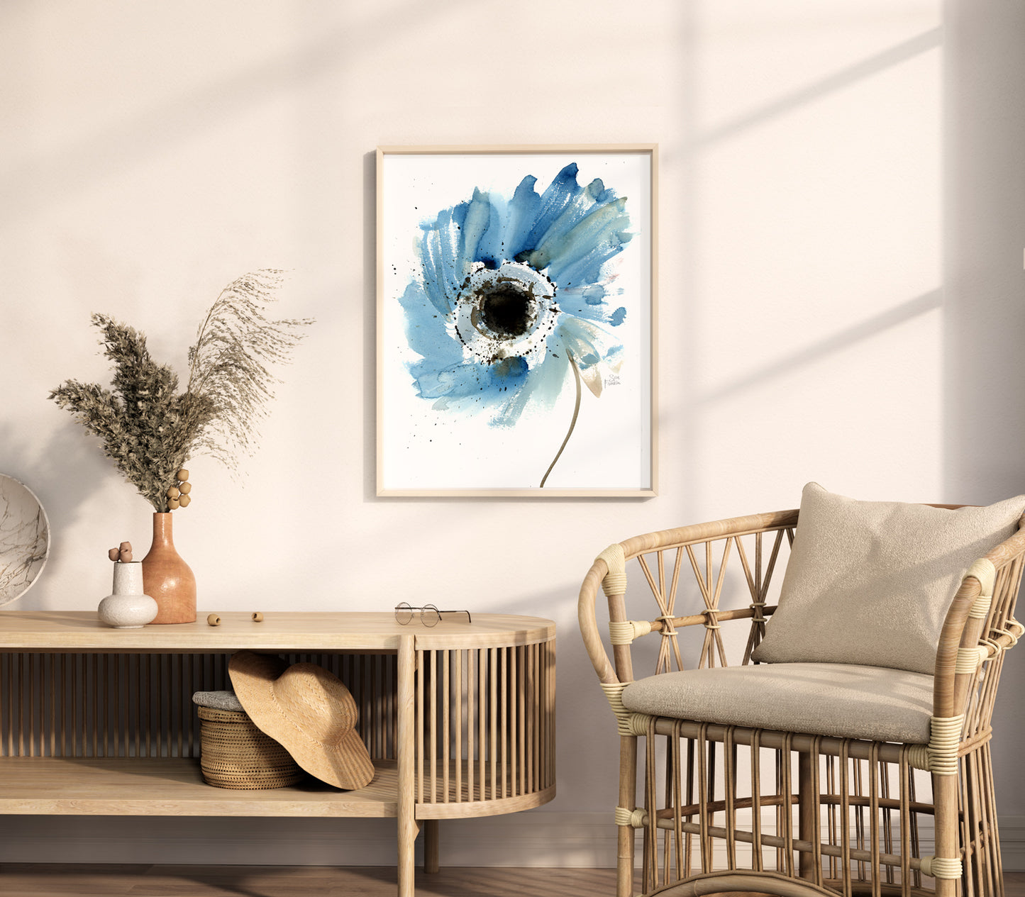 a living room with a chair and a painting on the wall