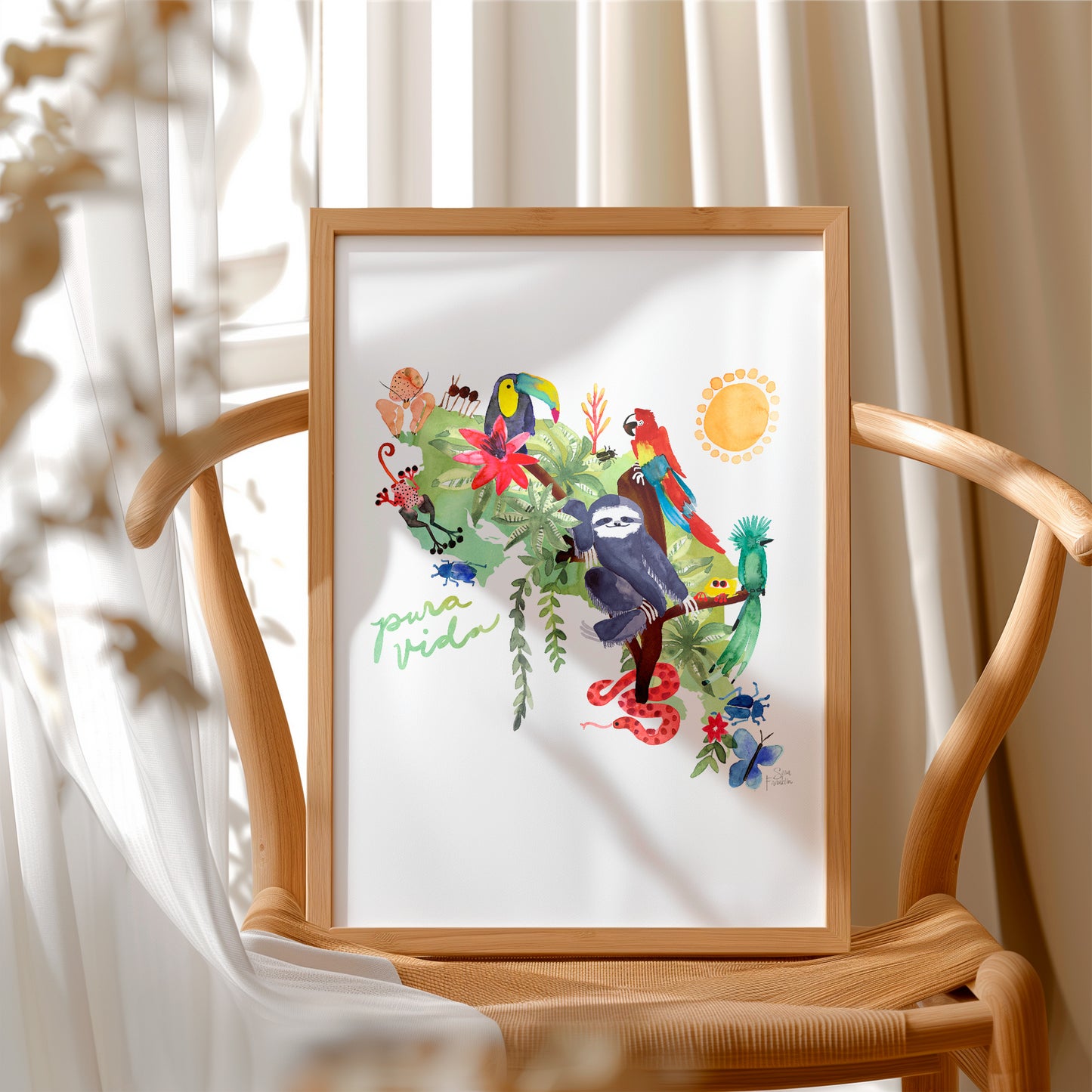 a picture frame with a picture of a tropical scene