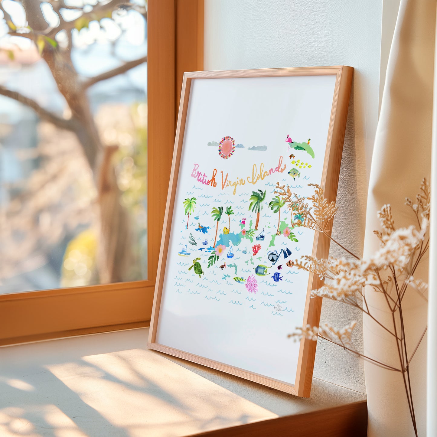 a picture frame sitting on a window sill next to a plant