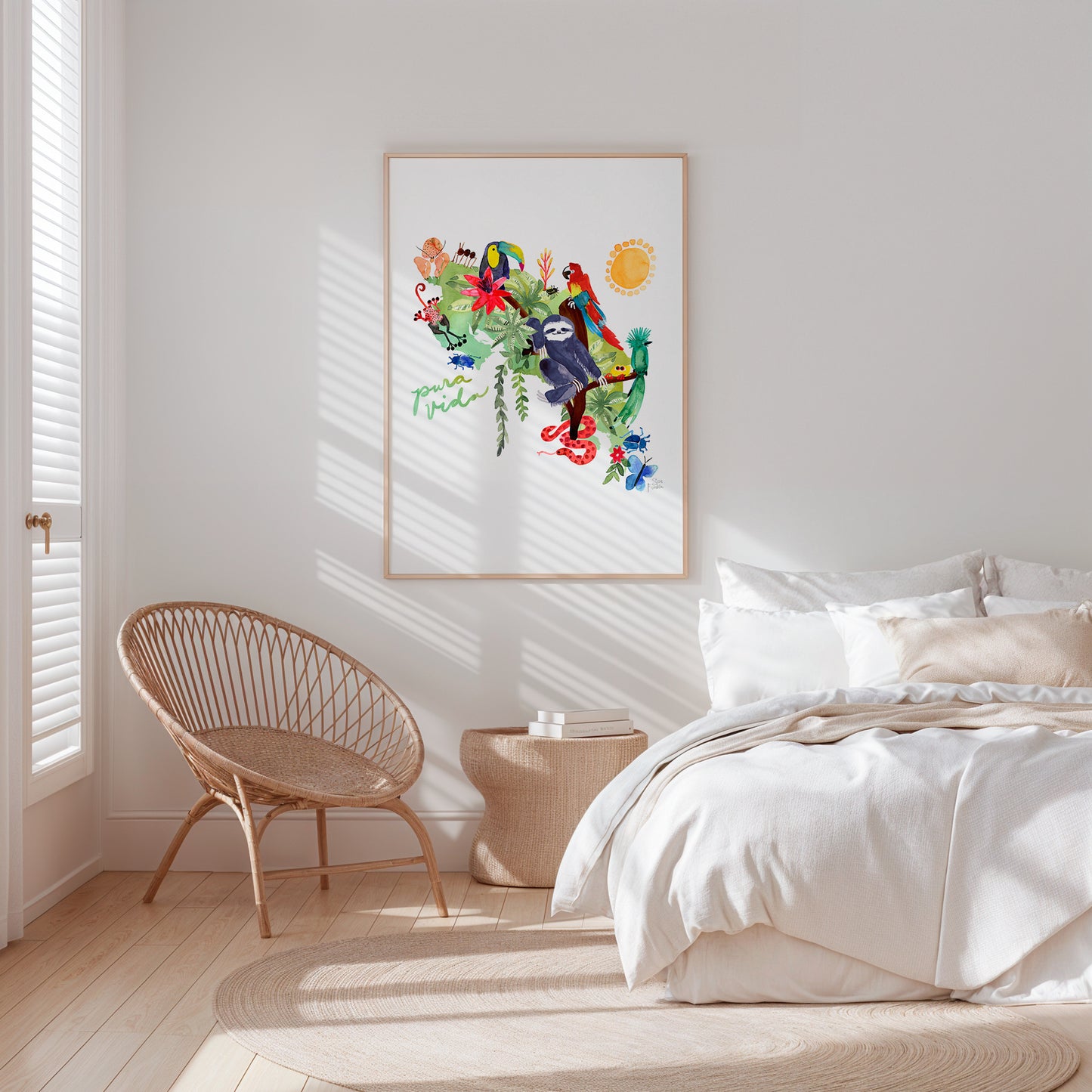 a bedroom with a bed, chair and a picture on the wall