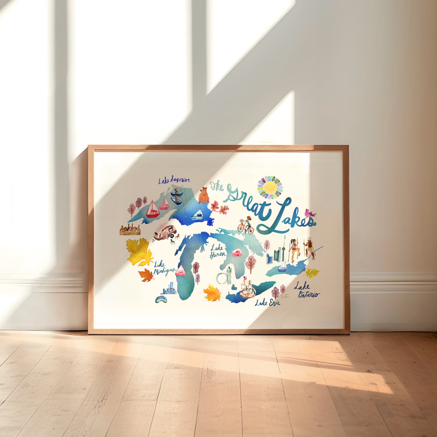 a picture frame sitting on a wooden floor in front of a wall