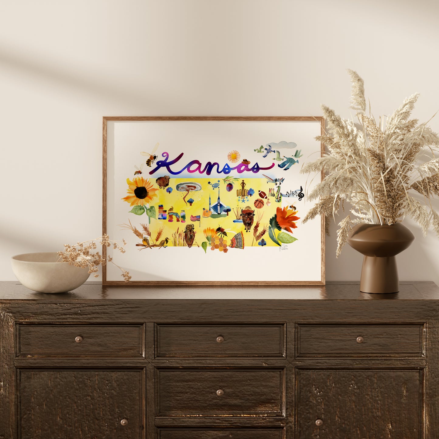a picture of a vase with flowers on top of a dresser
