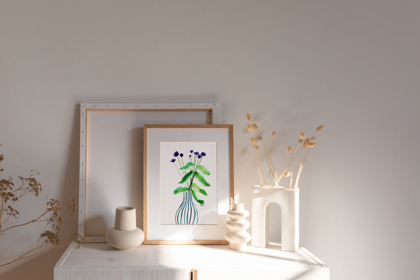 a picture of a vase and some flowers on a shelf
