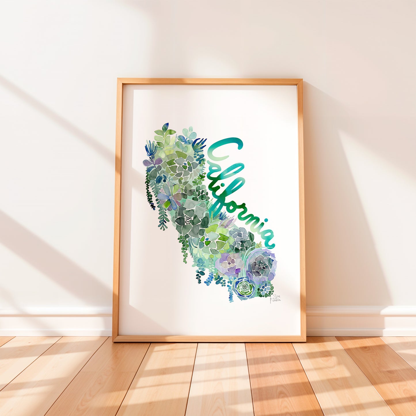a picture frame with a watercolor map of california