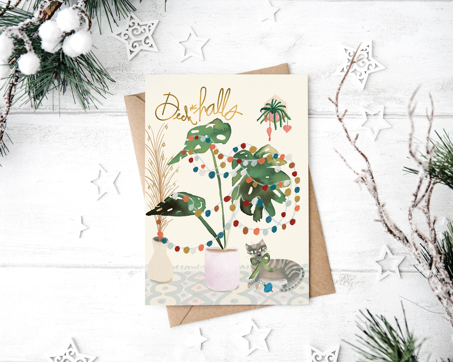 a greeting card with a cat and a plant