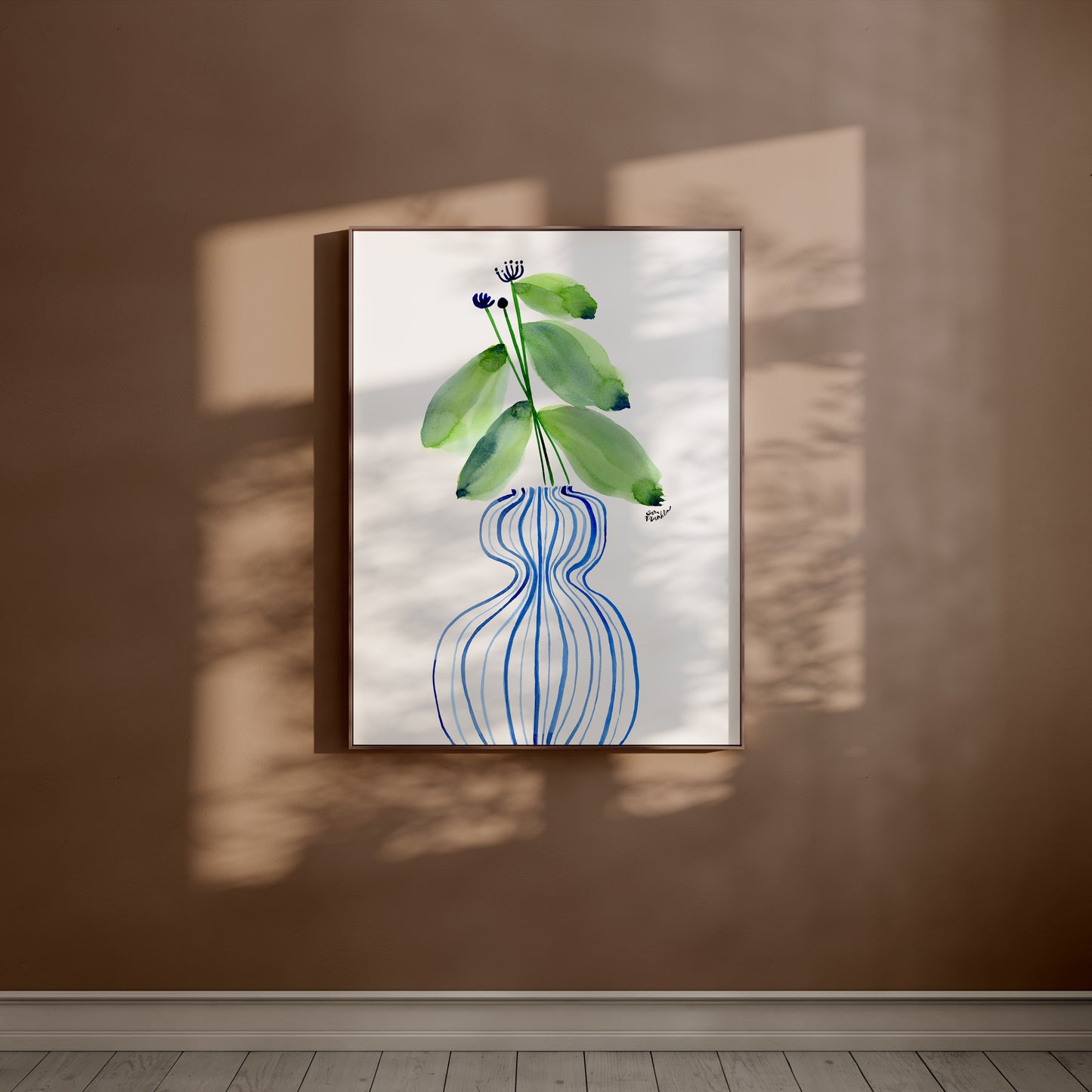 a picture of a plant hanging on a wall
