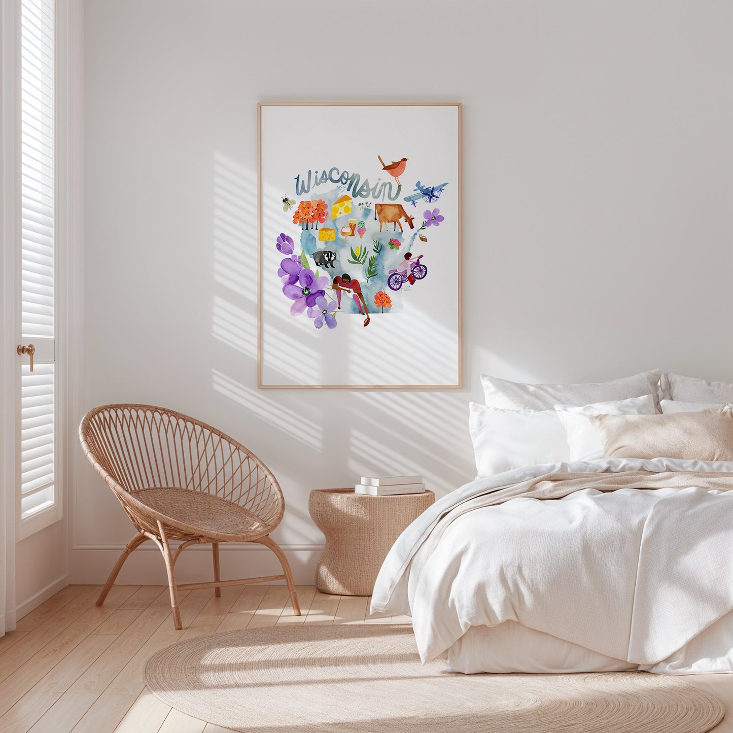 a bedroom with a bed, chair and a picture on the wall