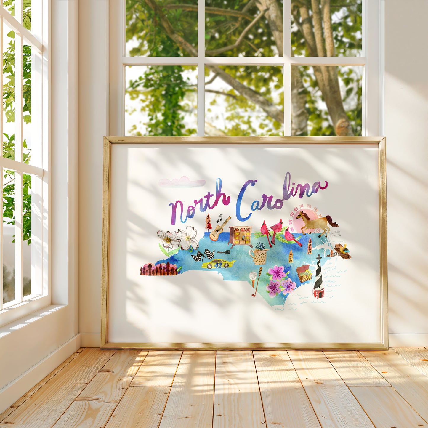 a picture of north carolina on a window sill