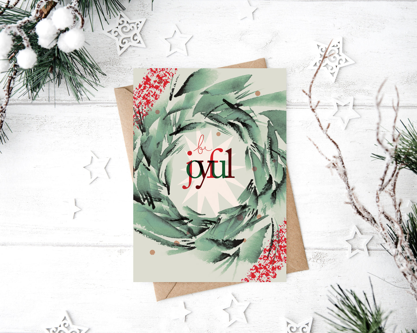 a christmas card with a wreath on top of it