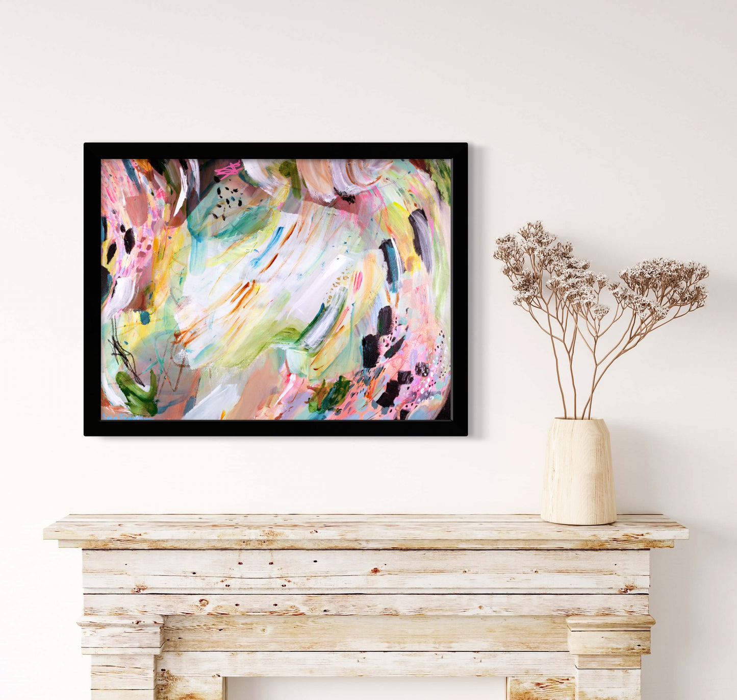a painting hanging on a wall above a fireplace