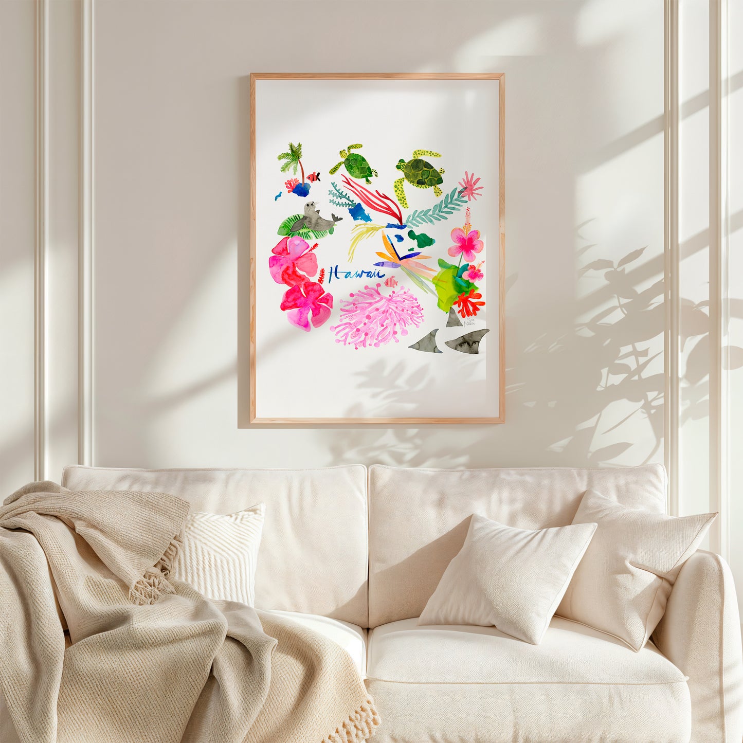 a living room with a white couch and a painting on the wall