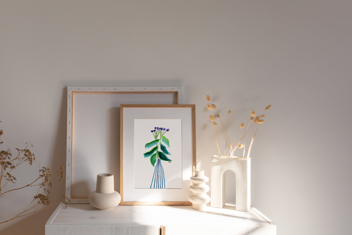 a picture of a vase and some flowers on a shelf