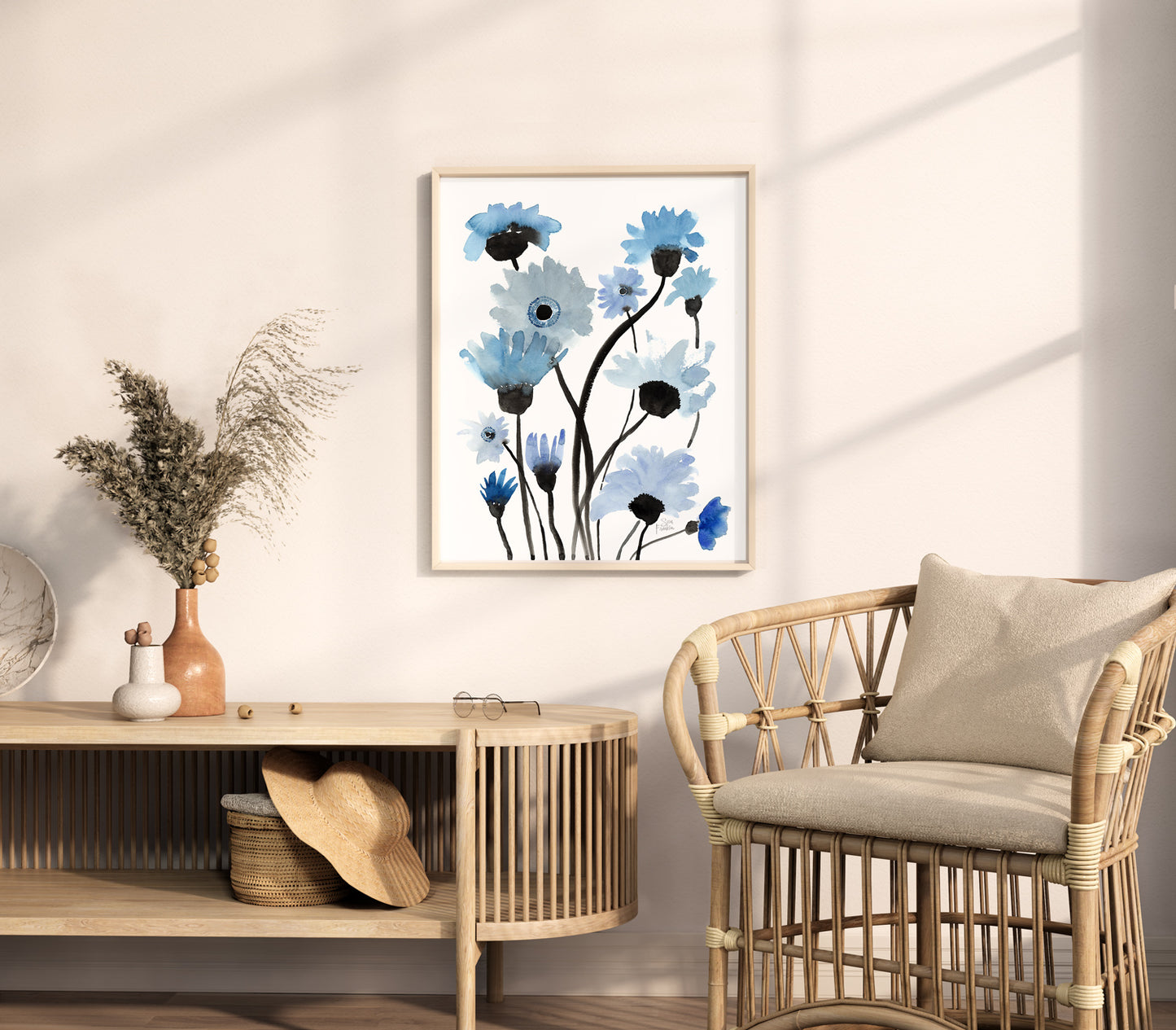 a room with a chair and a table with a vase on it