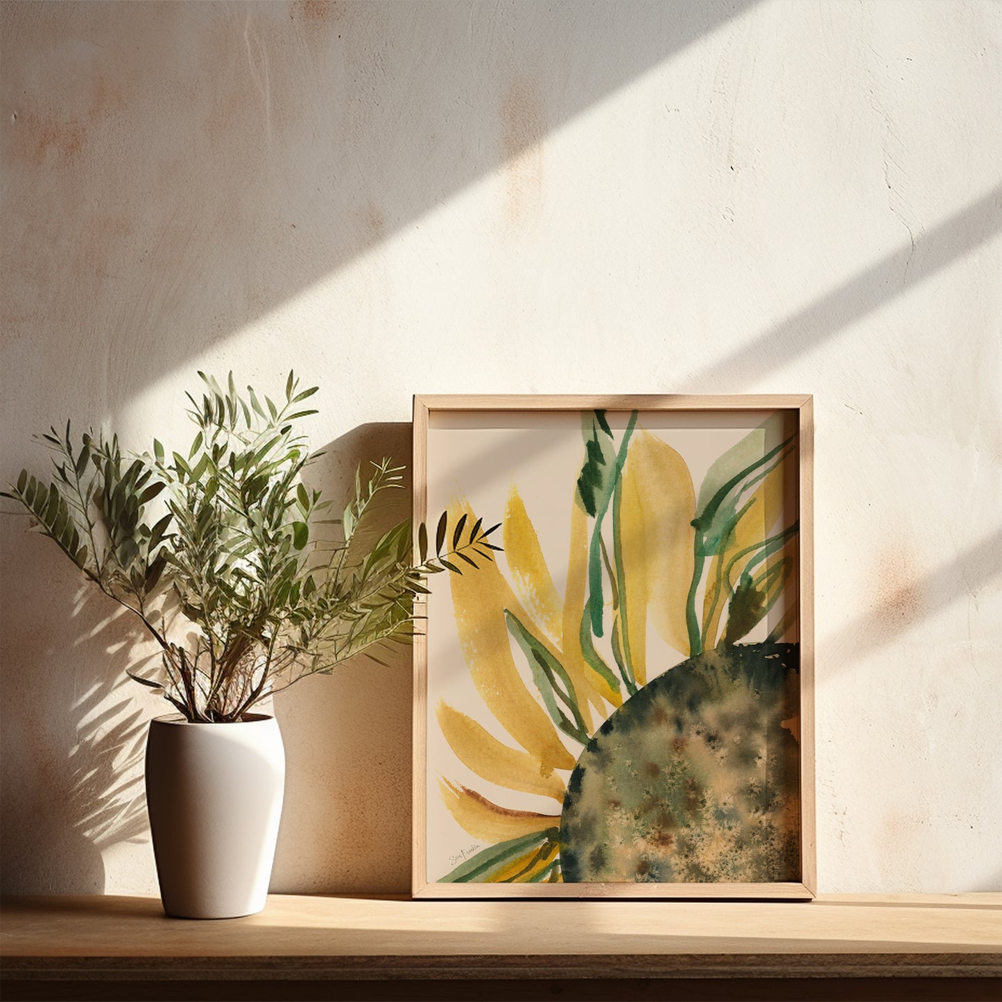 a white vase with a plant on a shelf, and a framed picture of a sunflower on the wall.