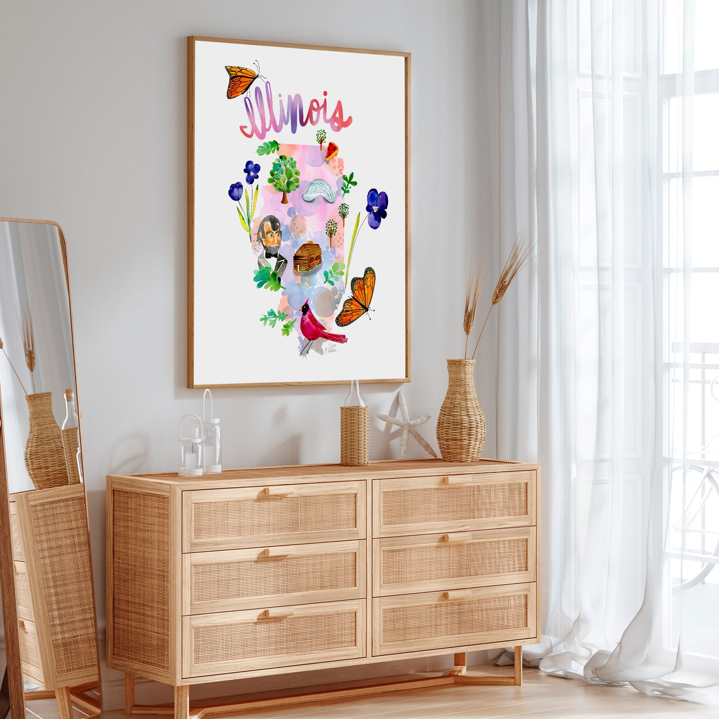 a picture hanging on a wall above a dresser