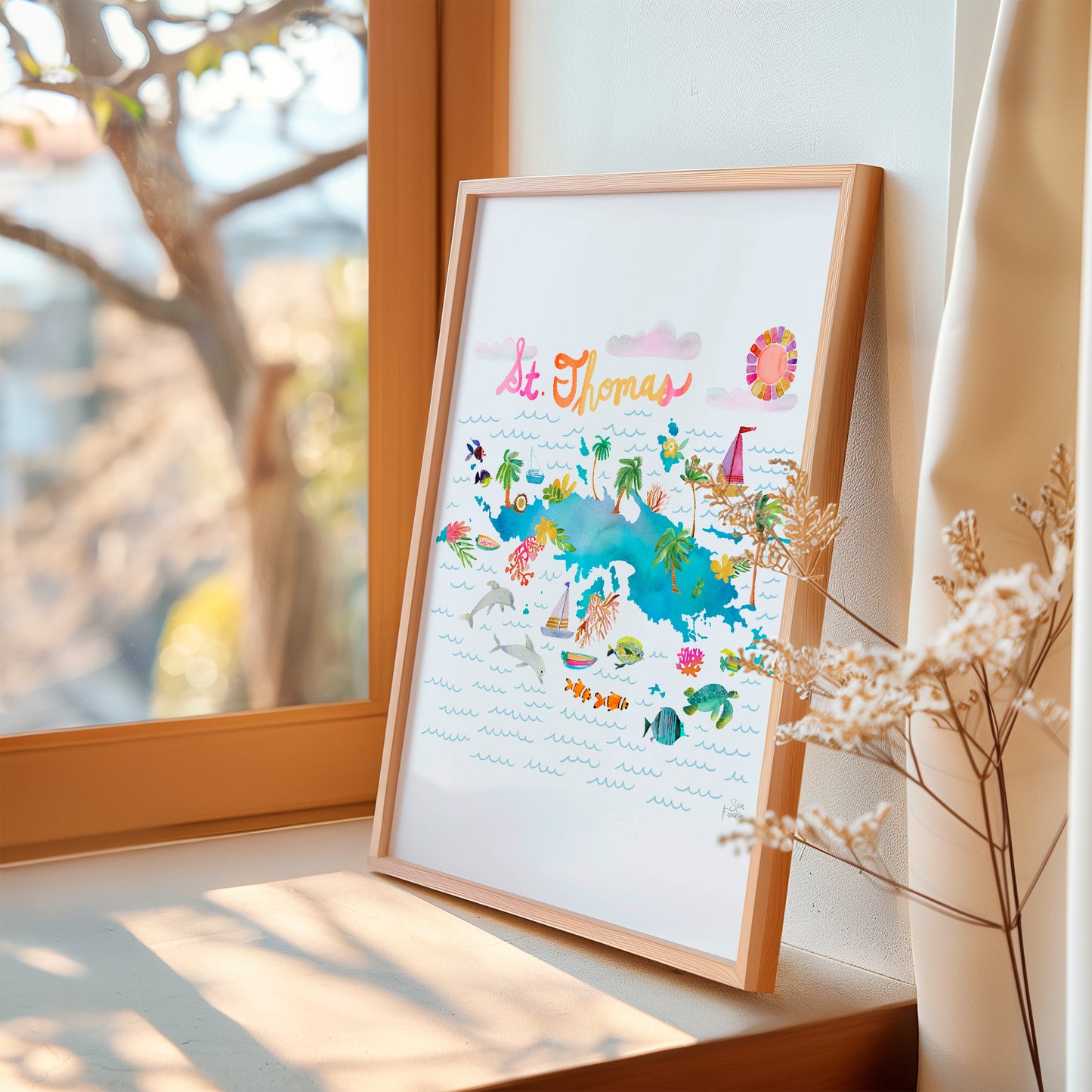 a picture frame sitting on a window sill next to a window