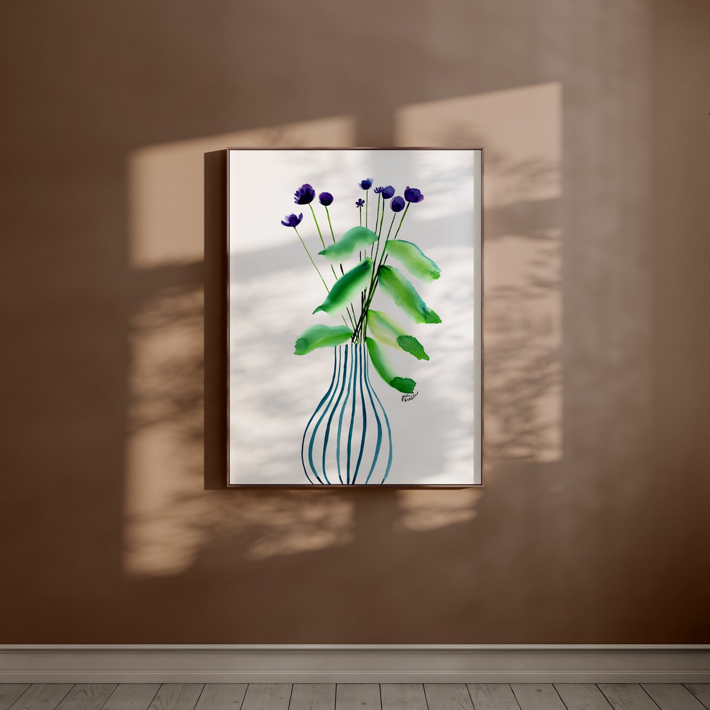 a picture of a vase with purple flowers hanging on a wall