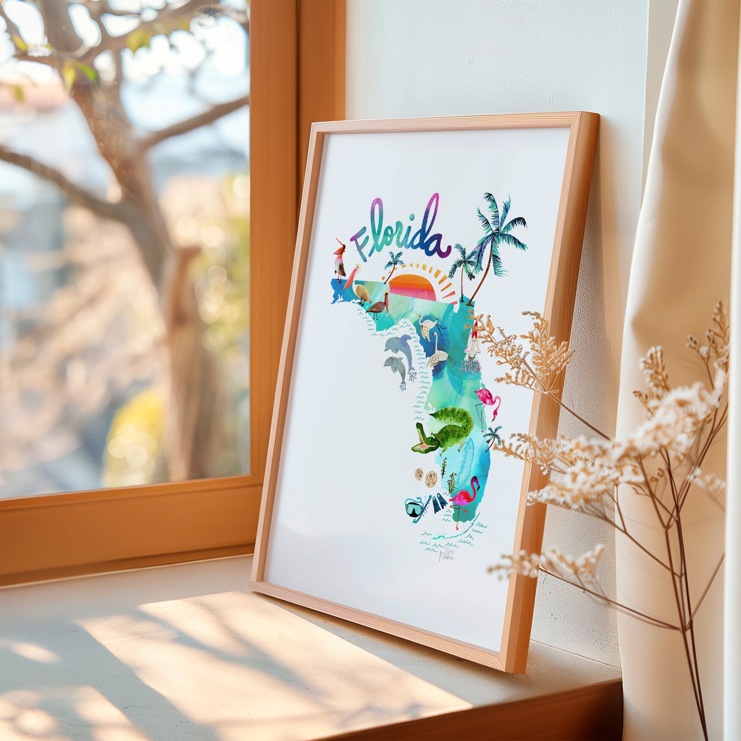 a picture of a picture hanging on a window sill