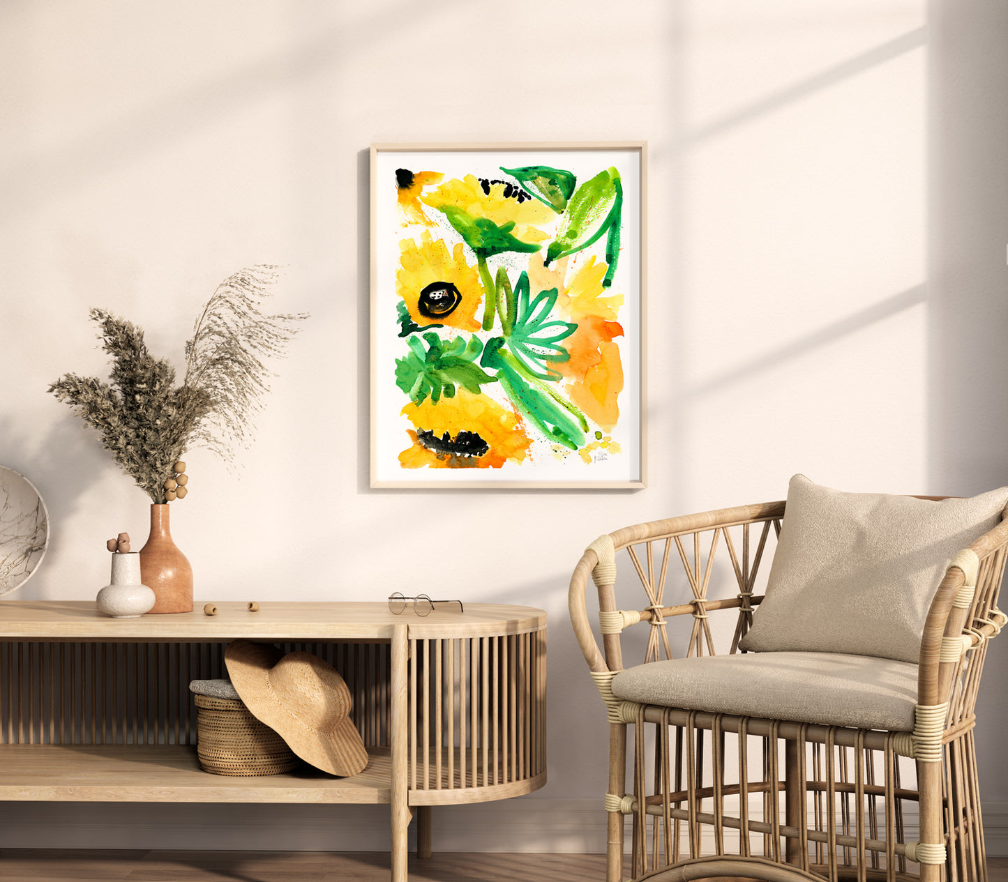 a room with a wicker chair and a painting on the wall