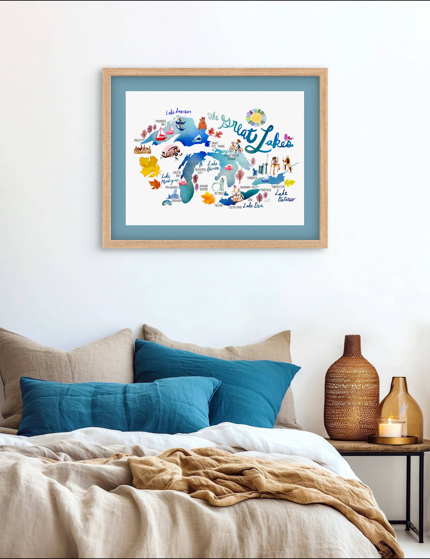 a bedroom with a bed and a picture hanging on the wall