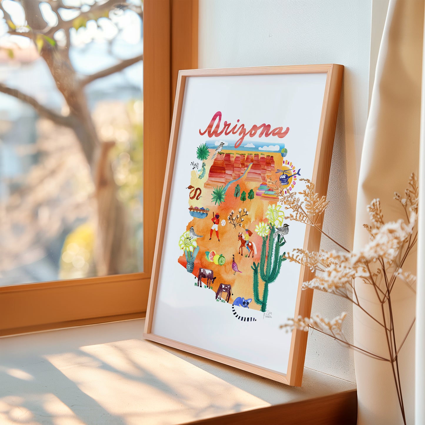 a picture of the state of arizona on a window sill