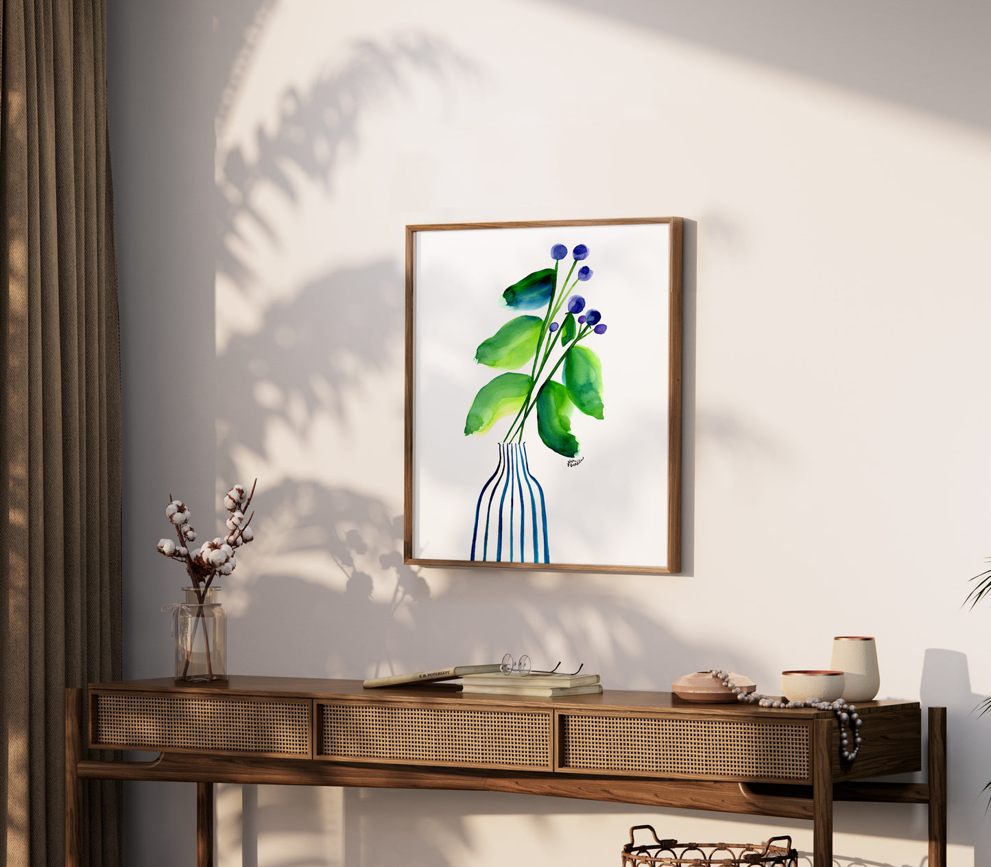 a painting of a plant on a wall above a table