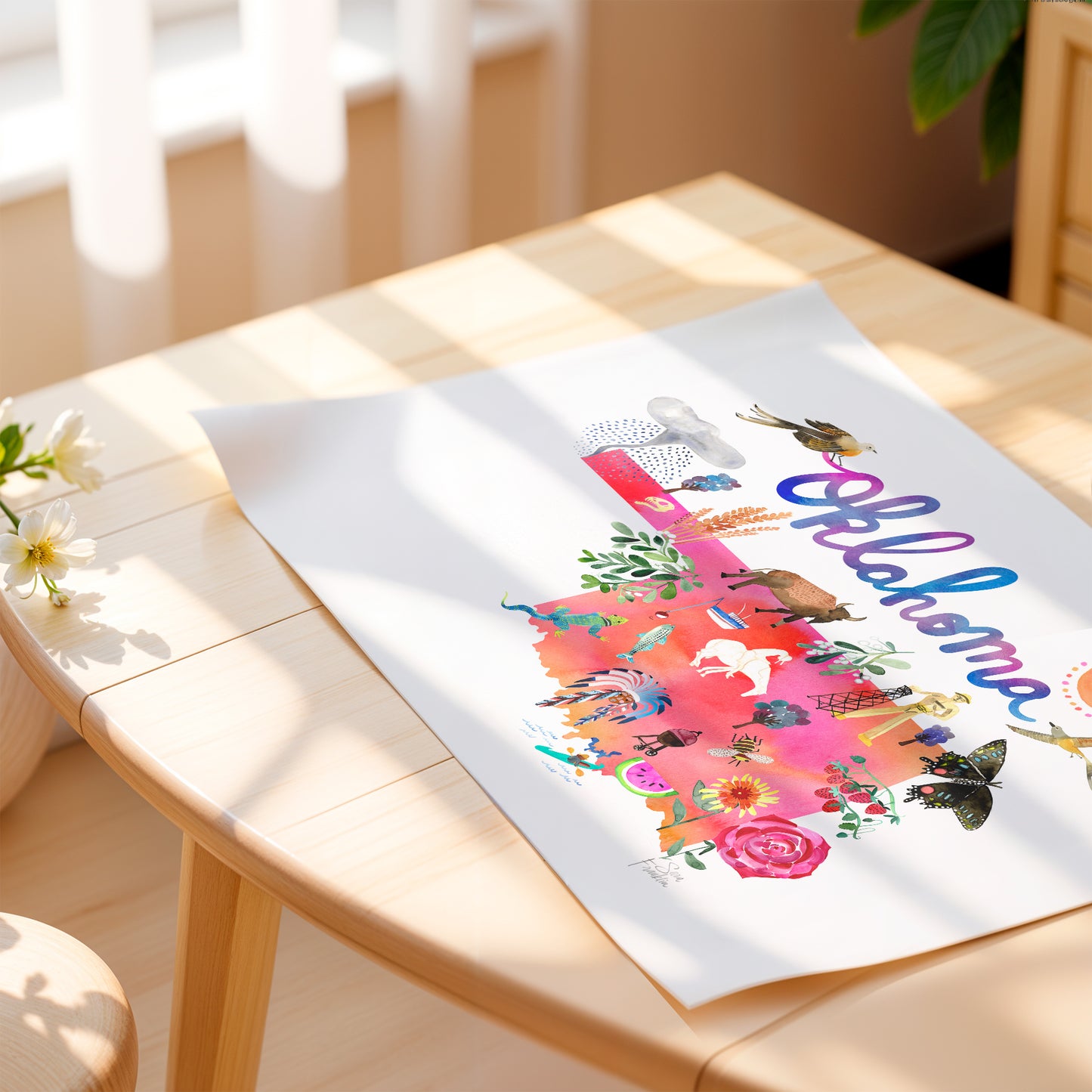 a picture of a card on a table with a vase of flowers