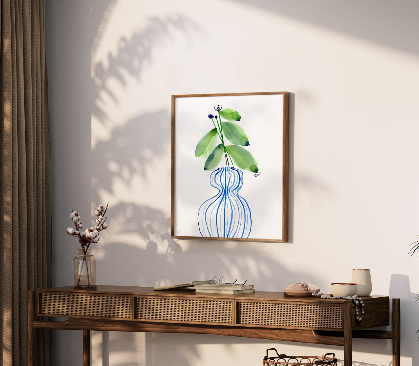 a picture of a plant hanging on a wall