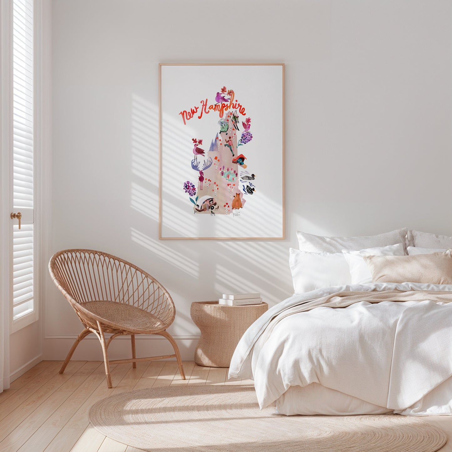 a bedroom with a bed, chair, and picture on the wall
