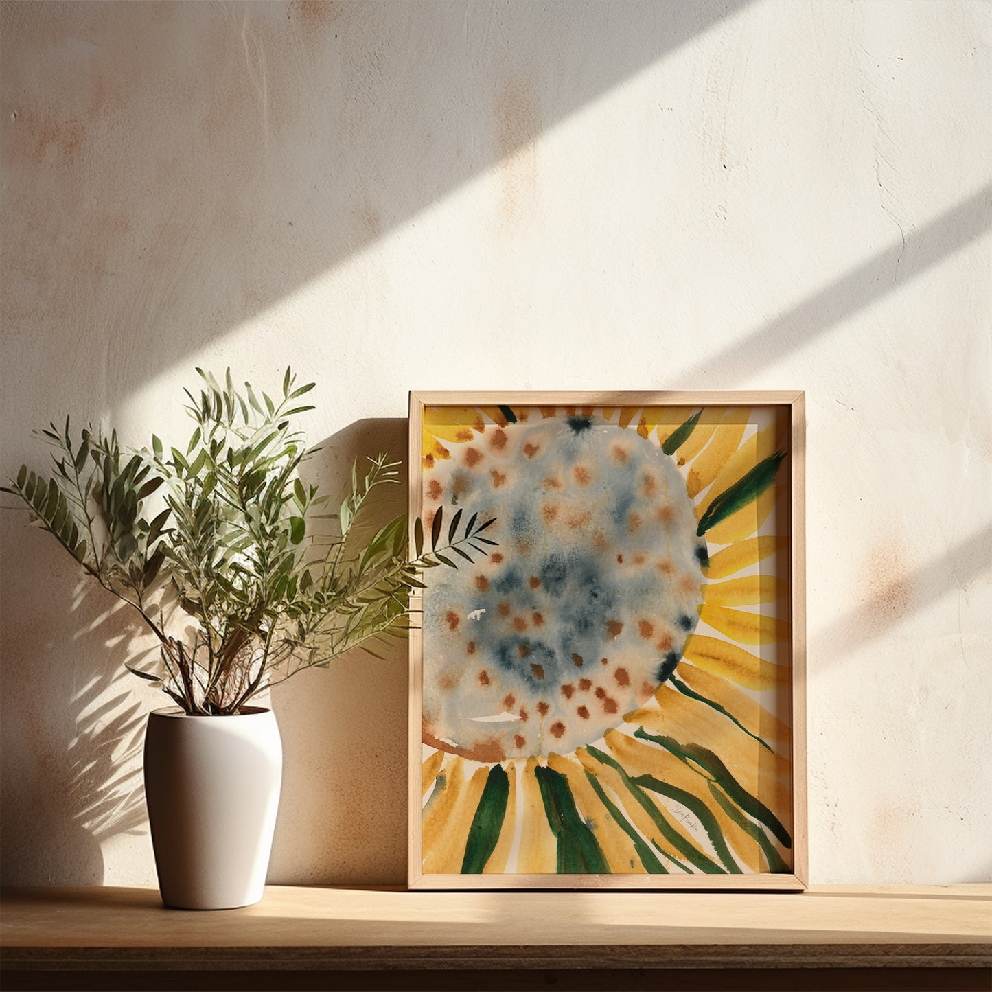 a white vase with a plant on a wooden shelf, accompanied by a framed painting of a sunflower.
