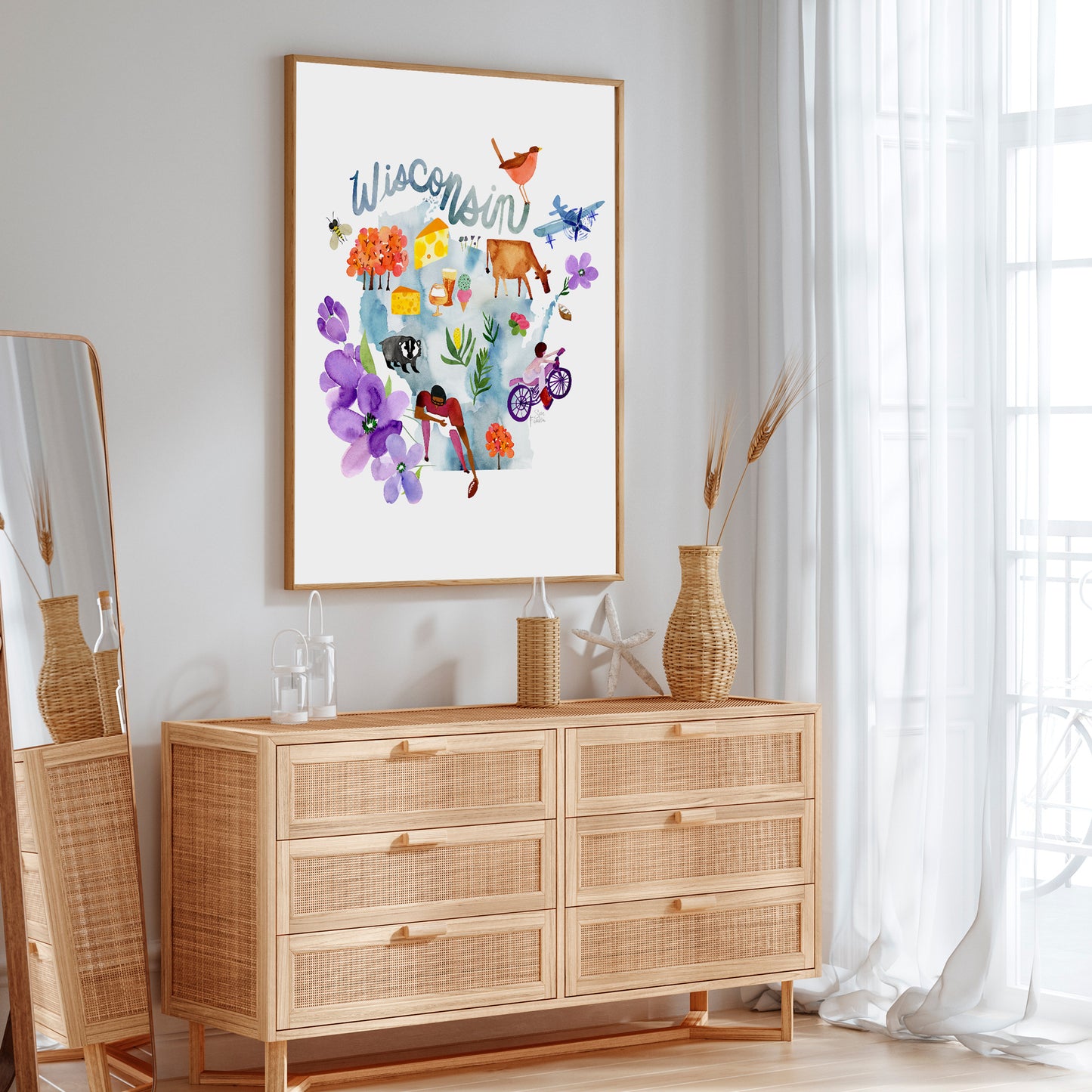 a picture hanging on a wall above a dresser