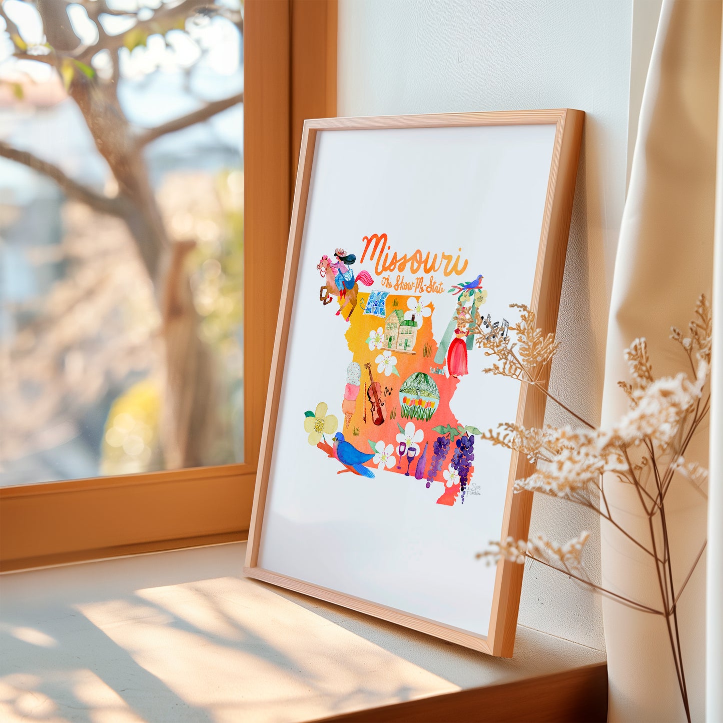 a picture of a window sill with a plant in front of it