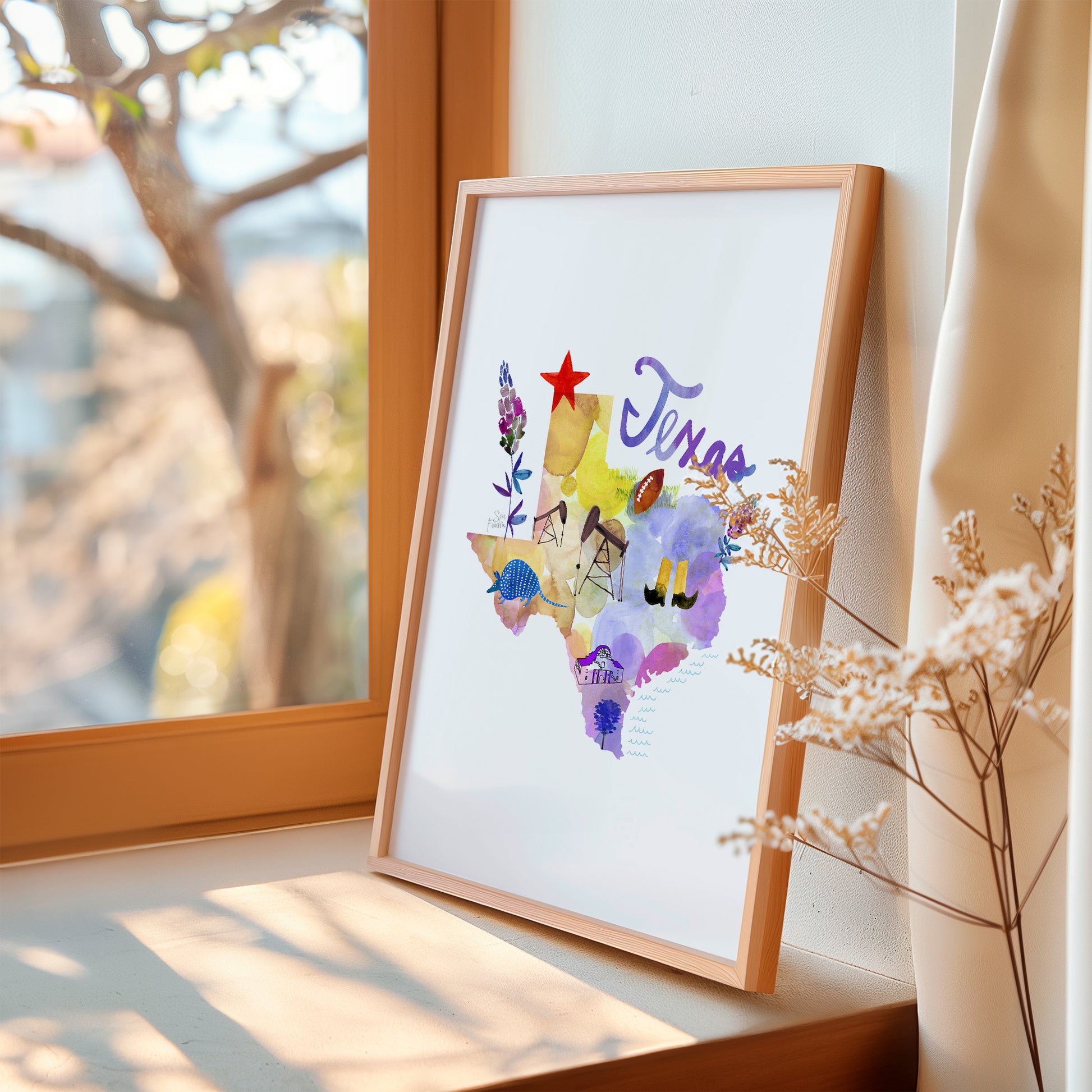 a picture frame with a picture of africa on it next to a window