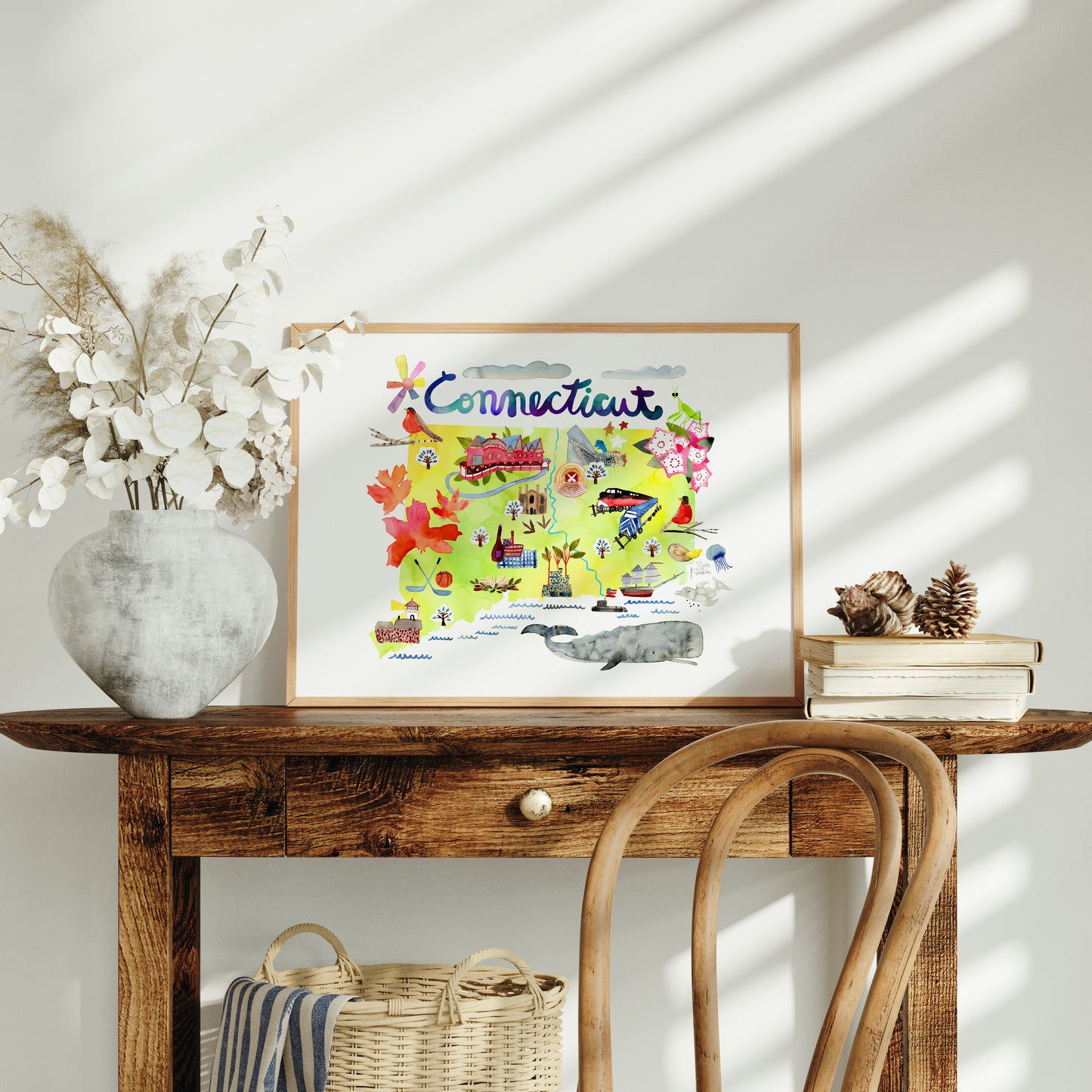 a wooden table with a basket and a picture on top of it