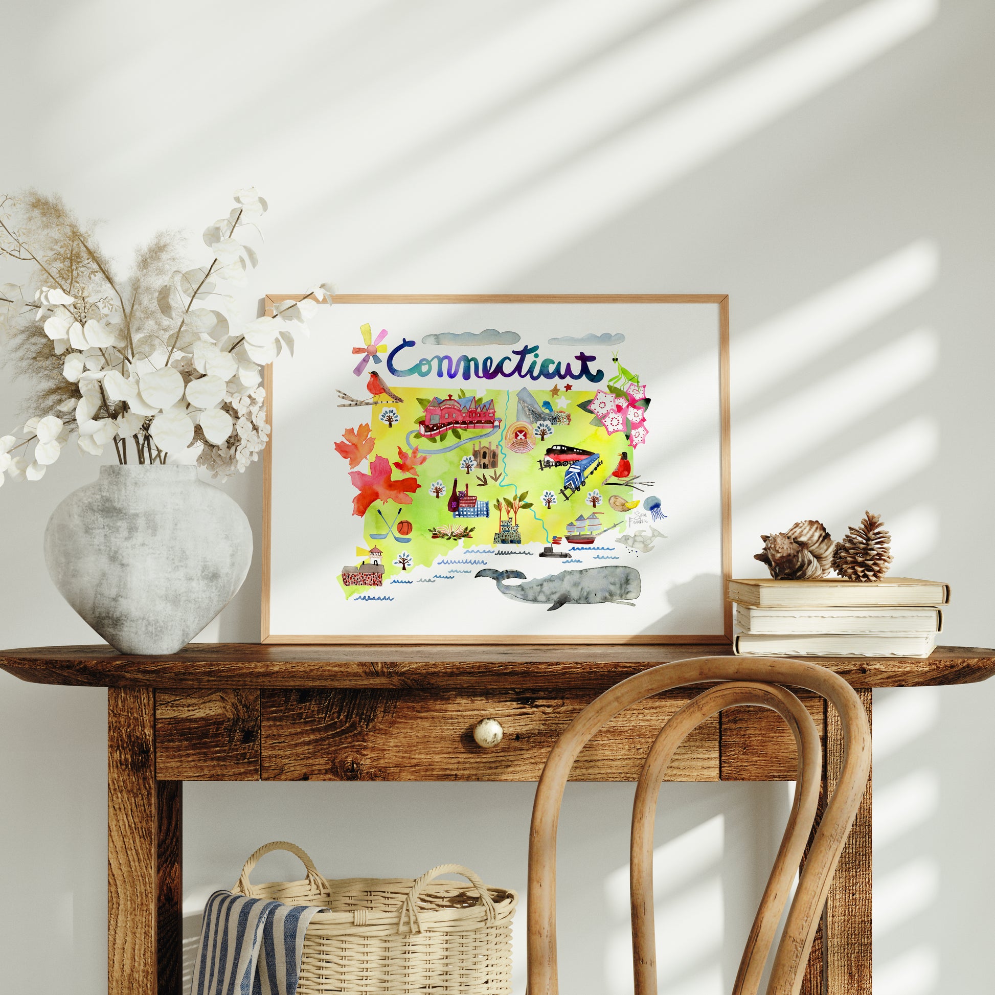 a wooden table with a basket and a picture on top of it