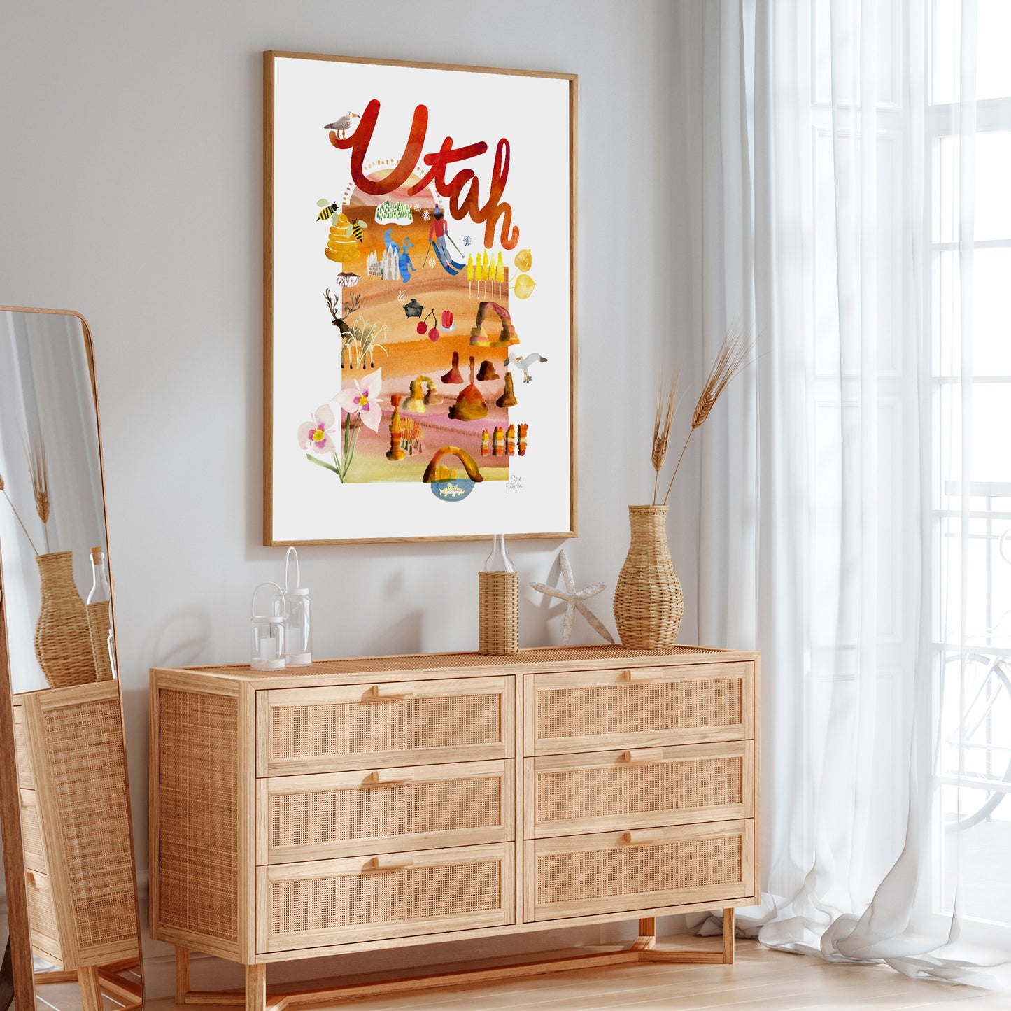 a picture hanging on a wall above a dresser