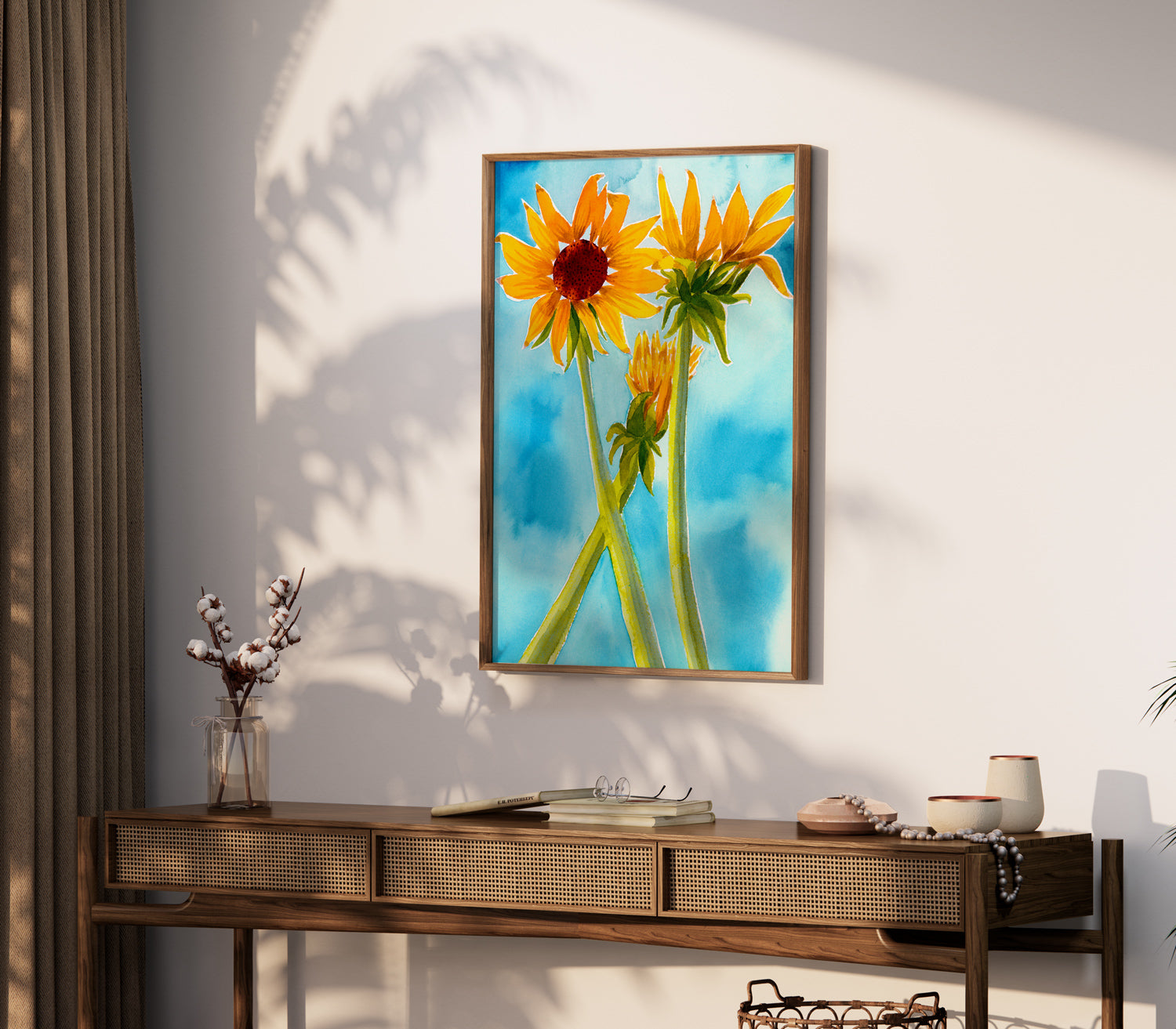 a painting of two yellow flowers on a white wall