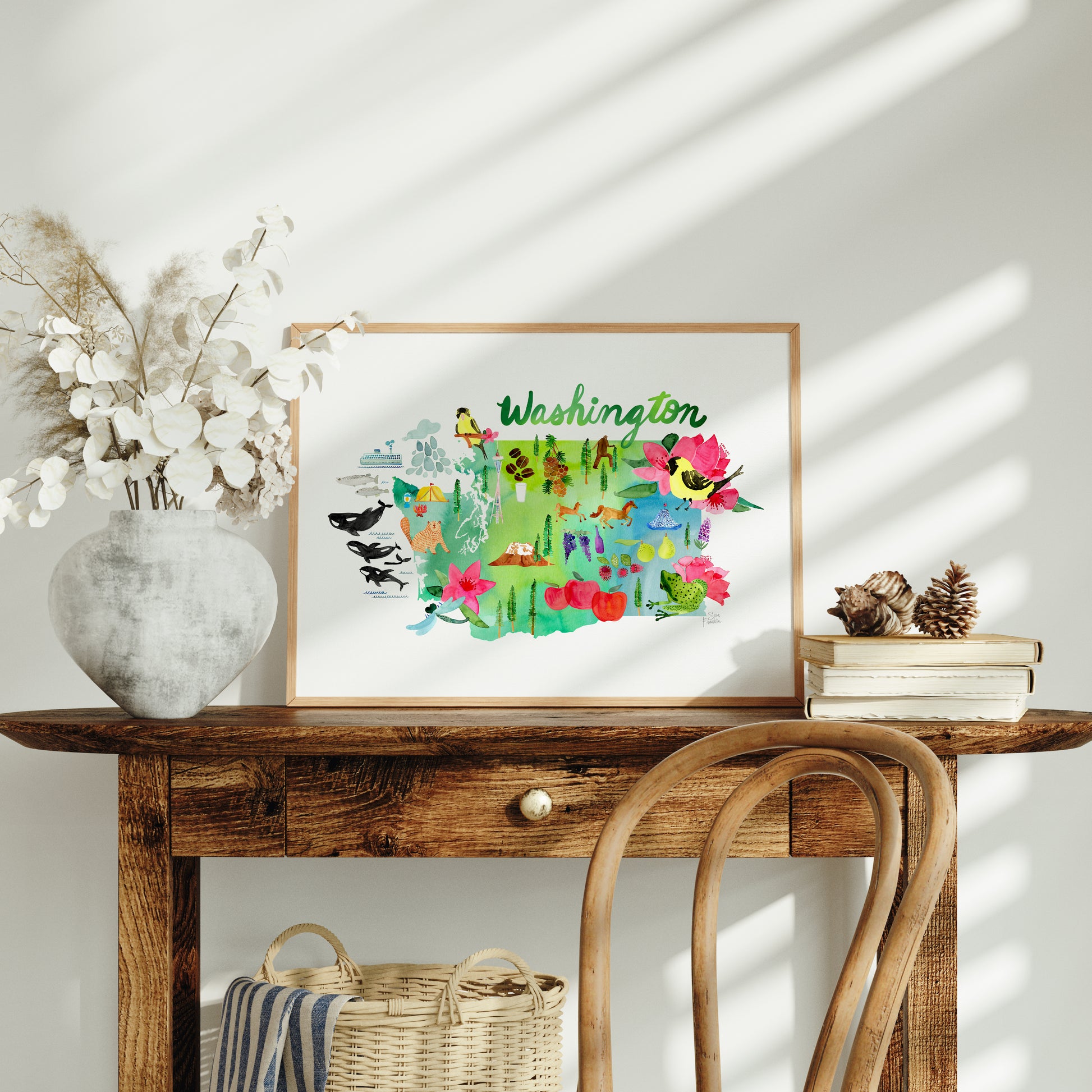 a wooden table topped with a vase filled with flowers