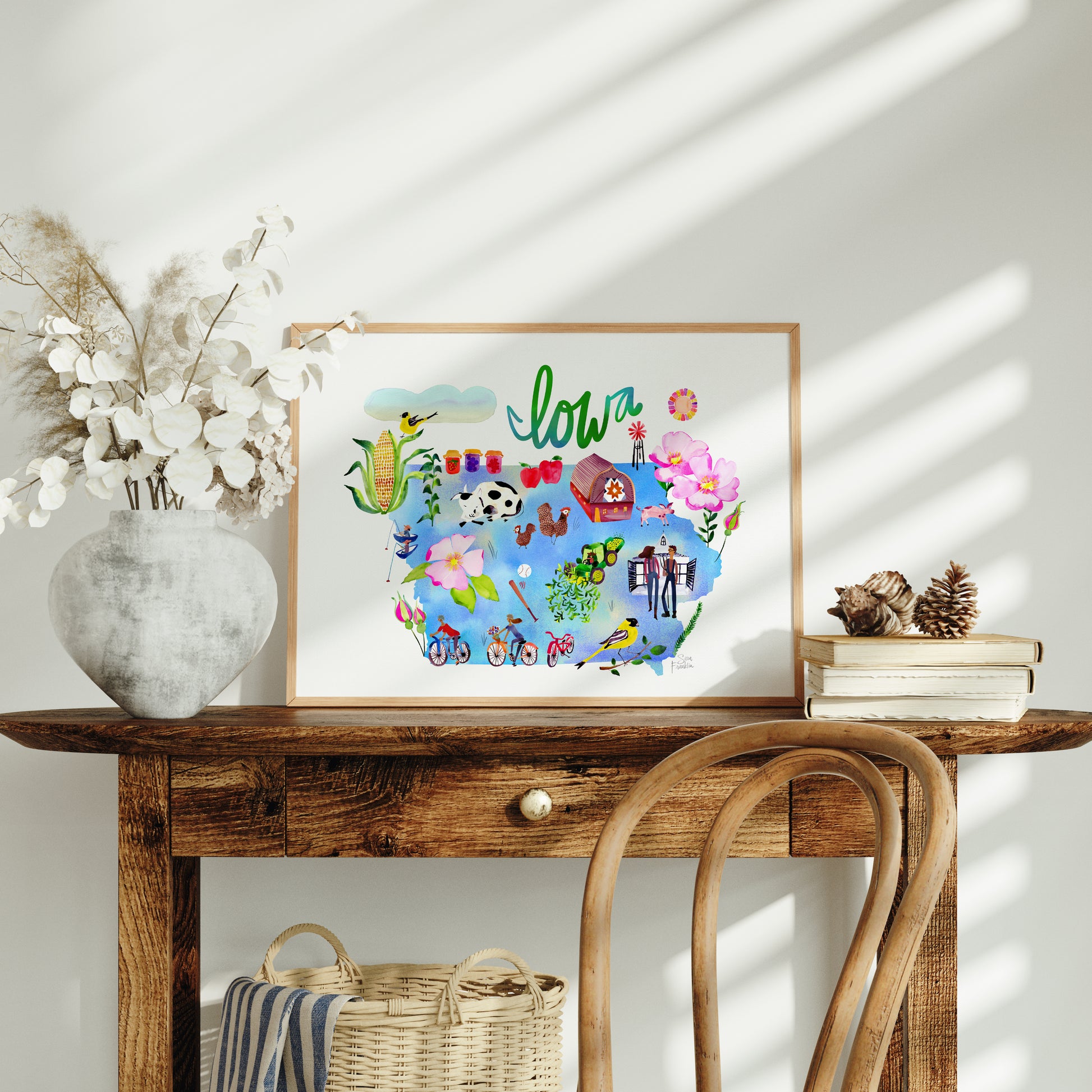 a wooden table with a basket and a picture on top of it