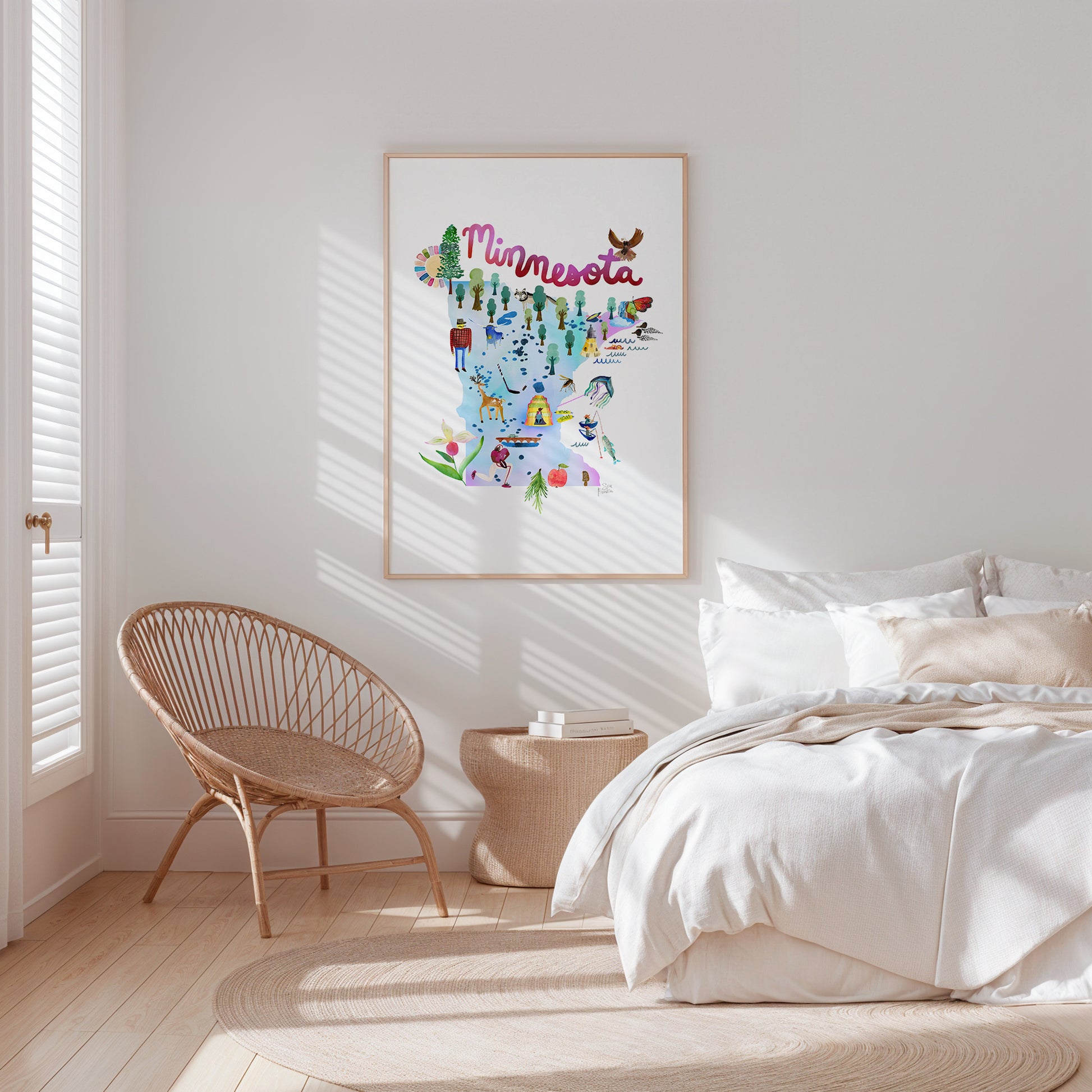 a bedroom with a bed, chair and a picture on the wall