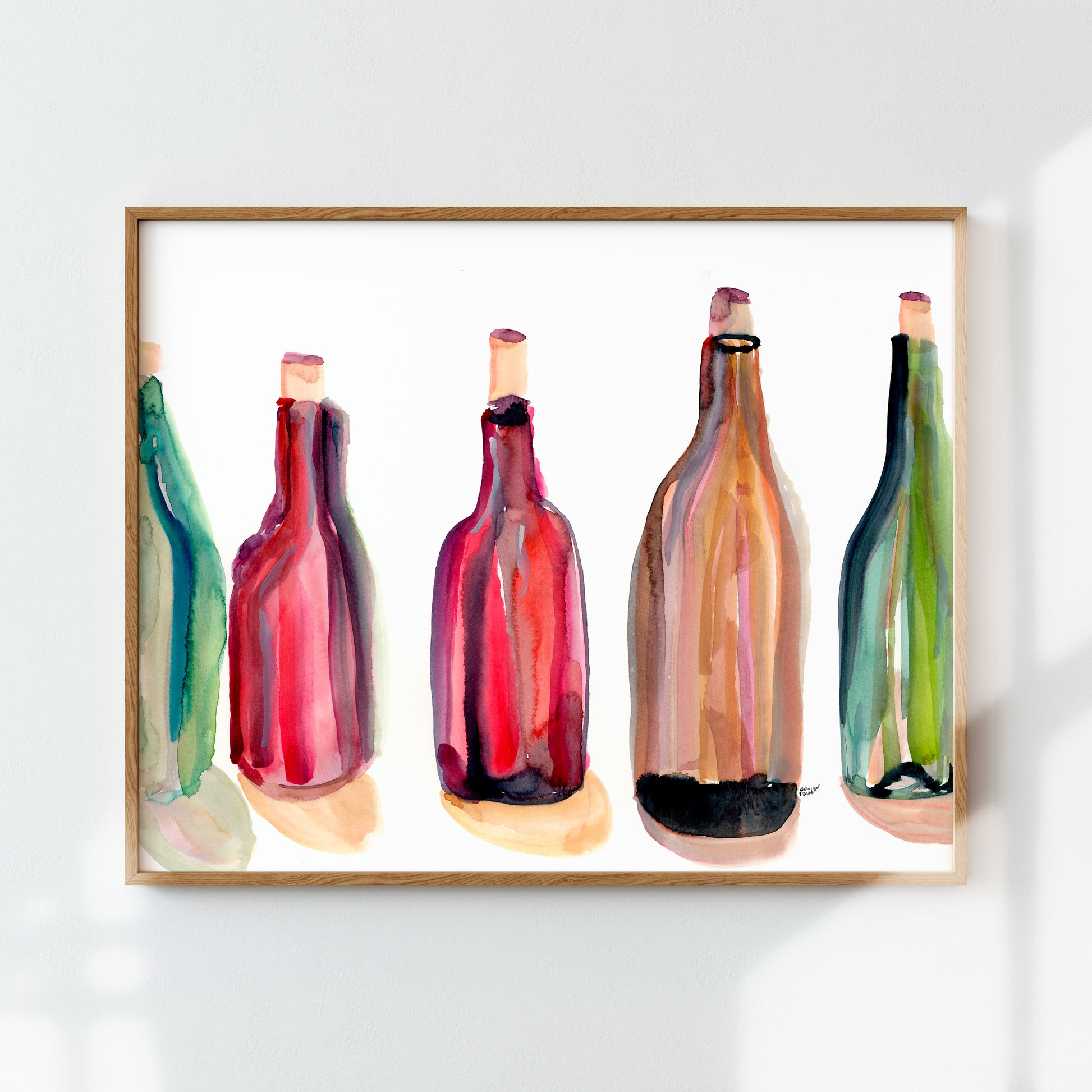 The image is a framed watercolor painting of five colorful wine bottles, each with a unique design and color.
