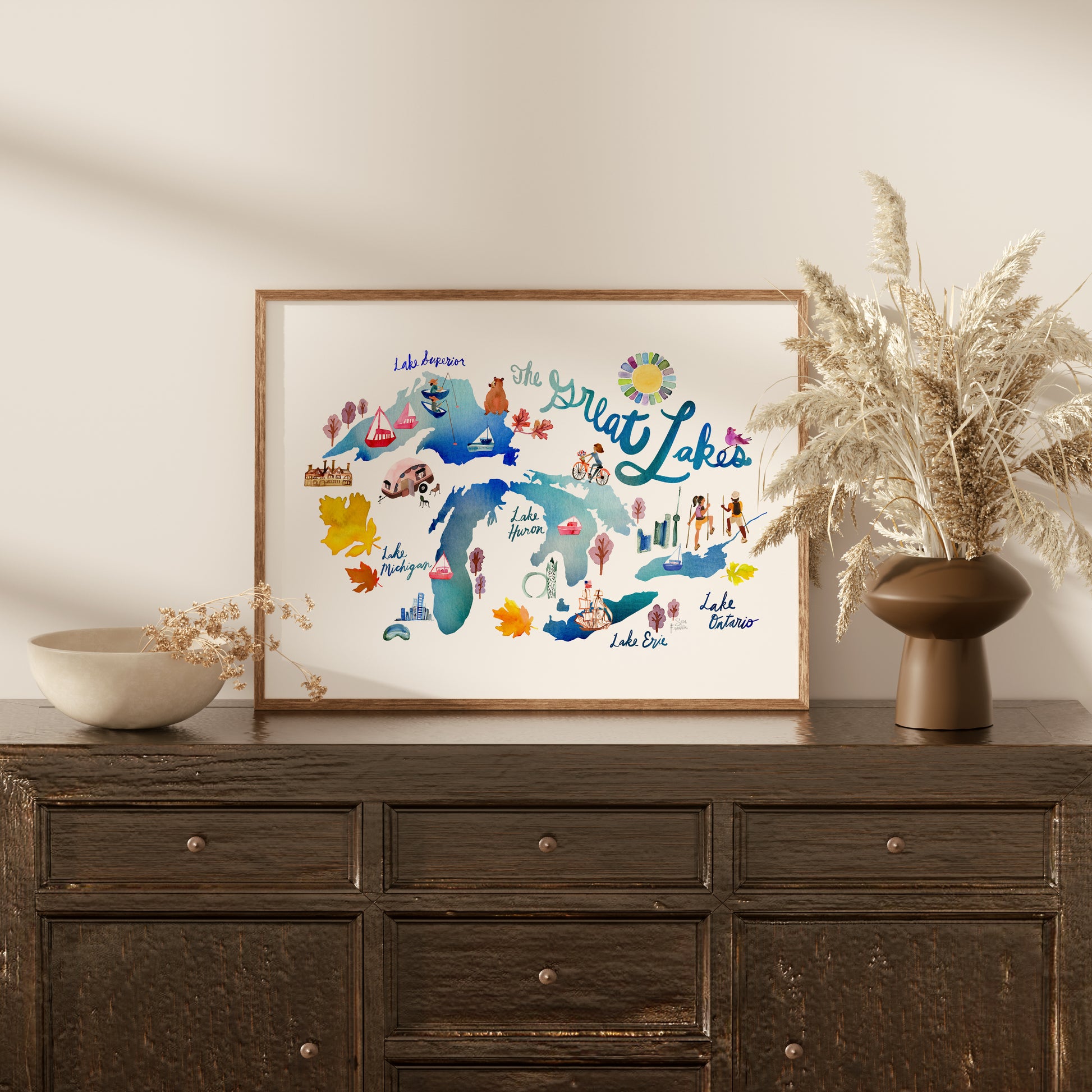 a wooden dresser with a vase of flowers on top of it