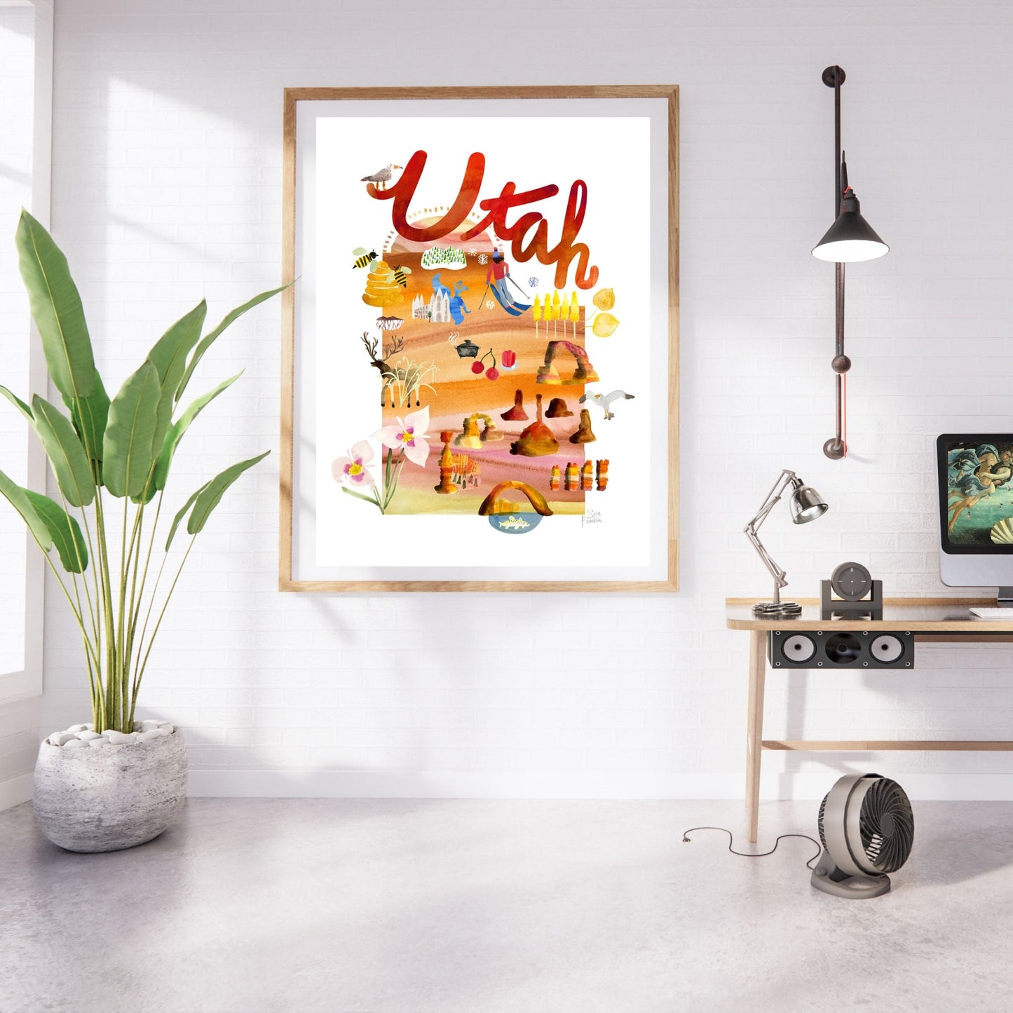 a picture hanging on a wall in a room