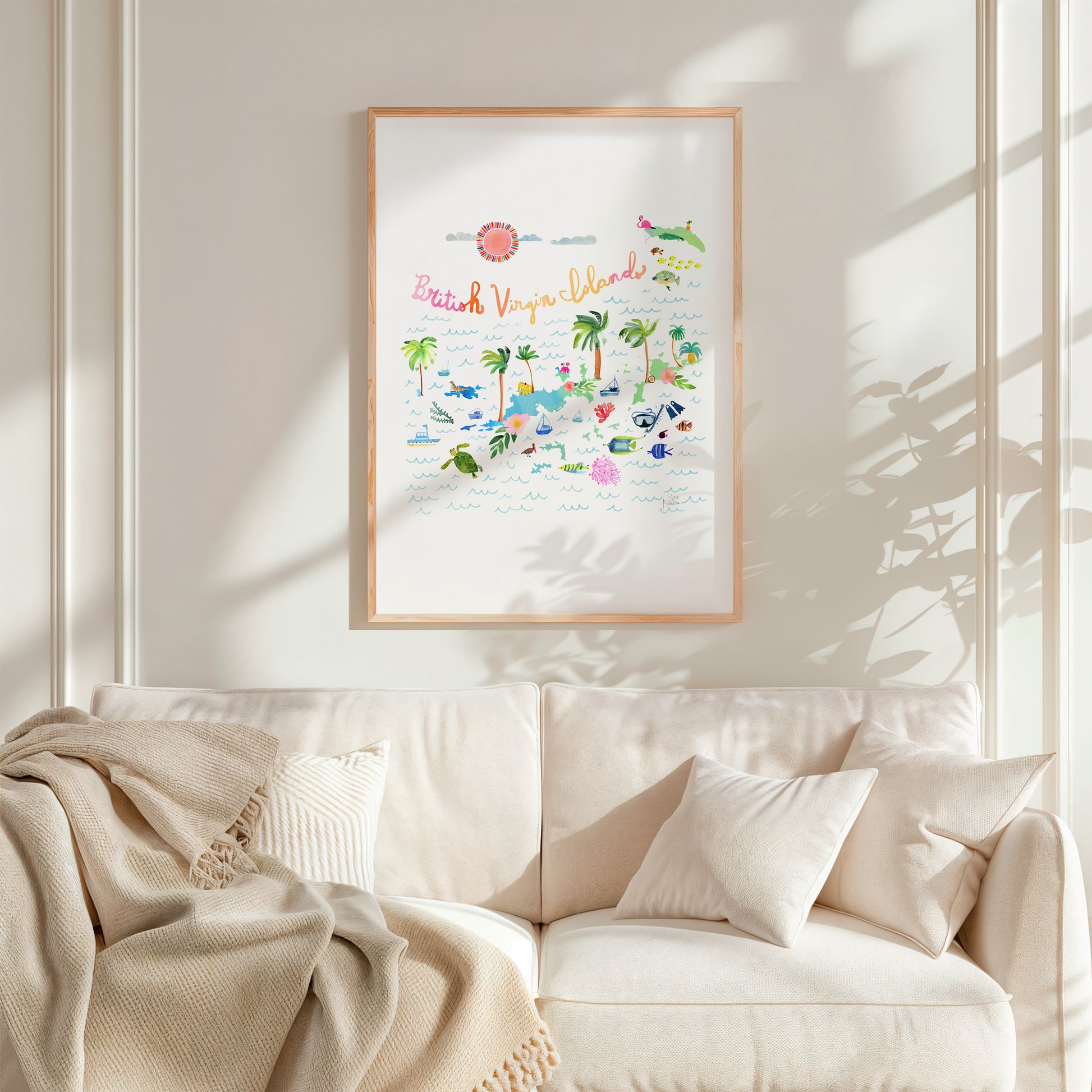 a living room with a white couch and a white blanket