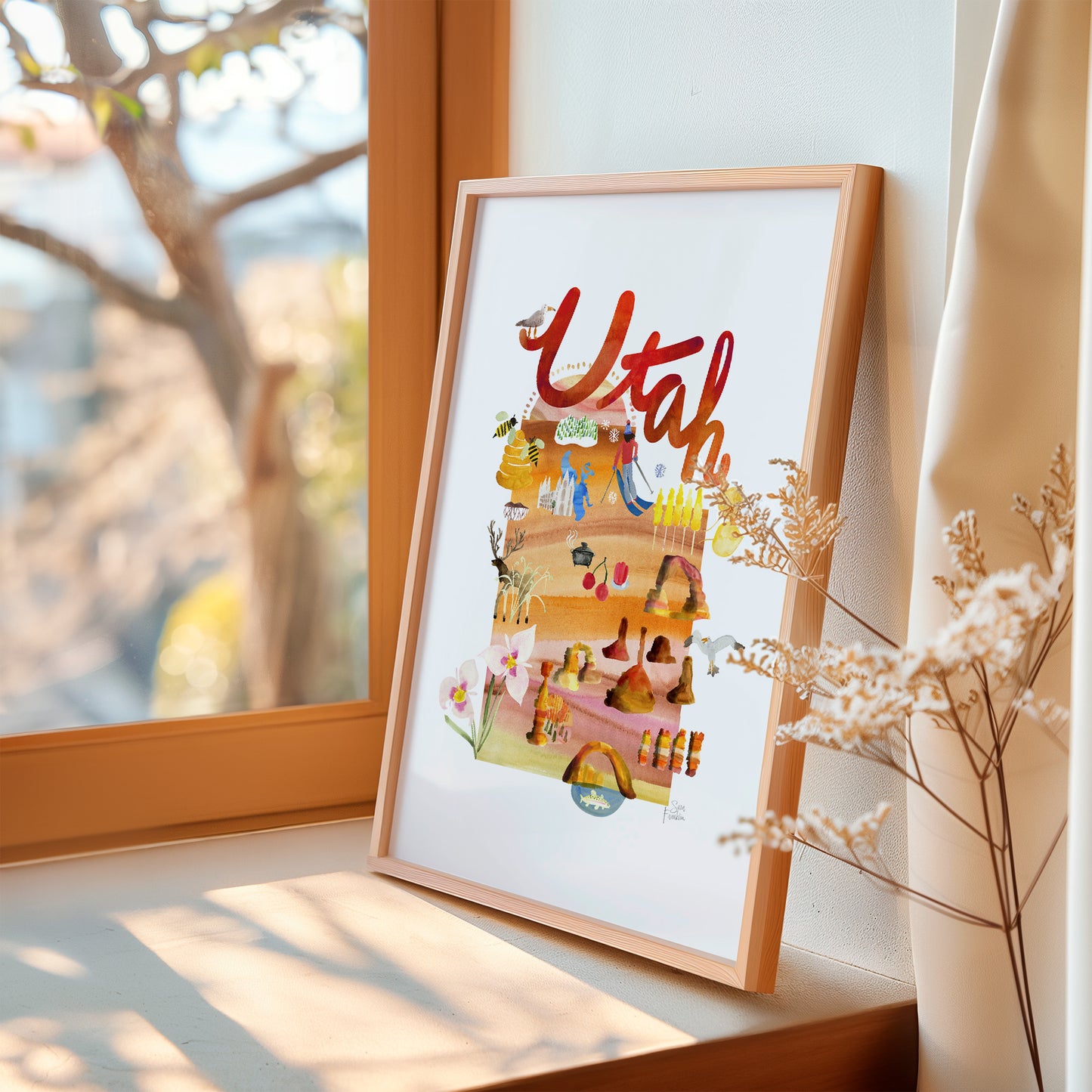 a picture of a picture hanging on a window sill