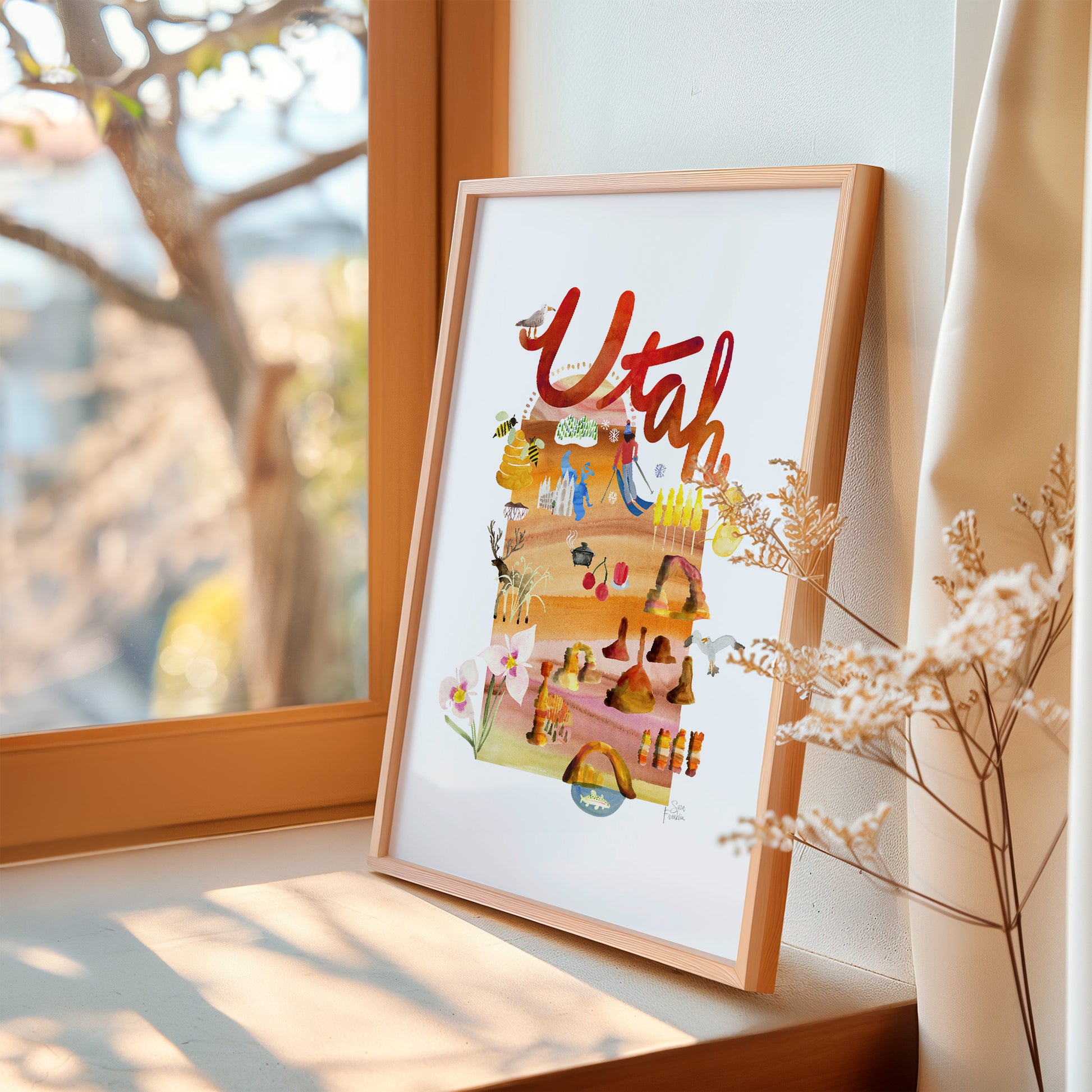 a picture of a picture hanging on a window sill