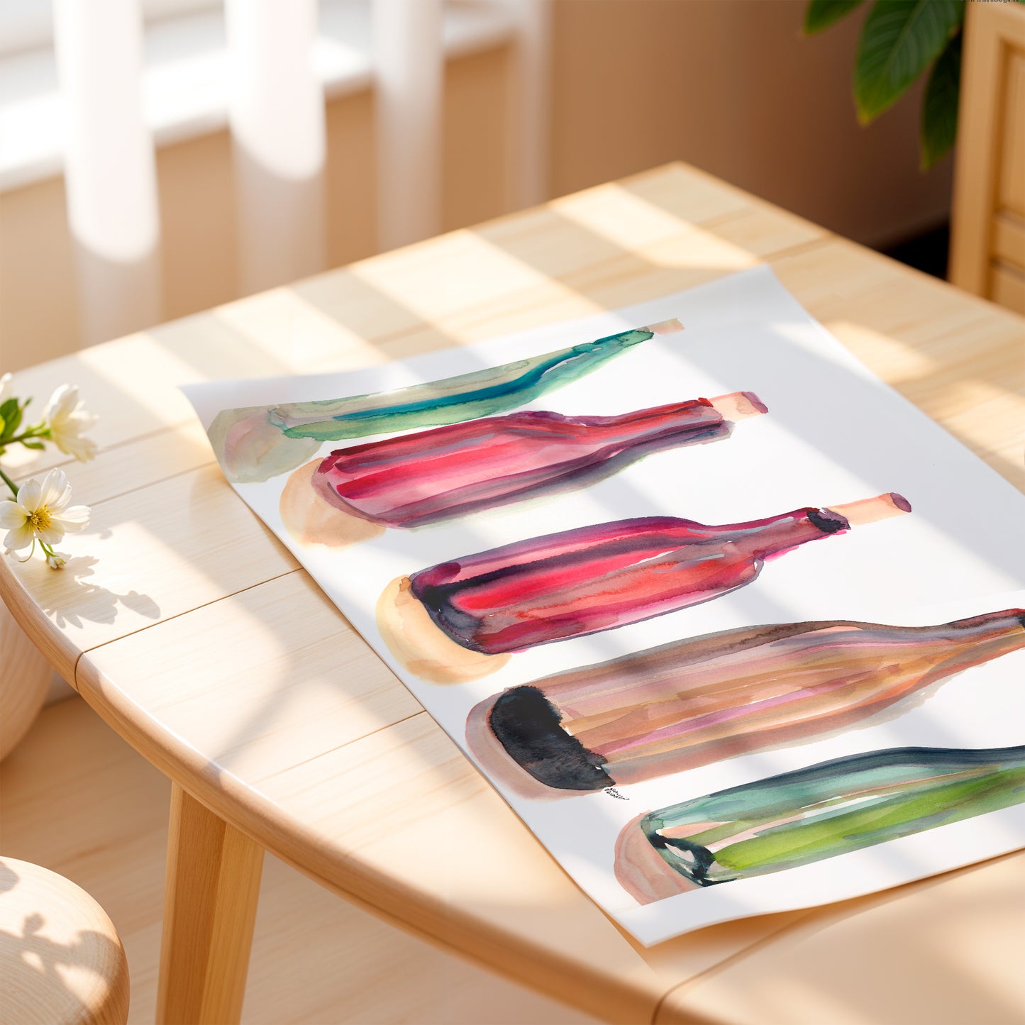 a wooden table with a painting of colorful wine bottles on it.